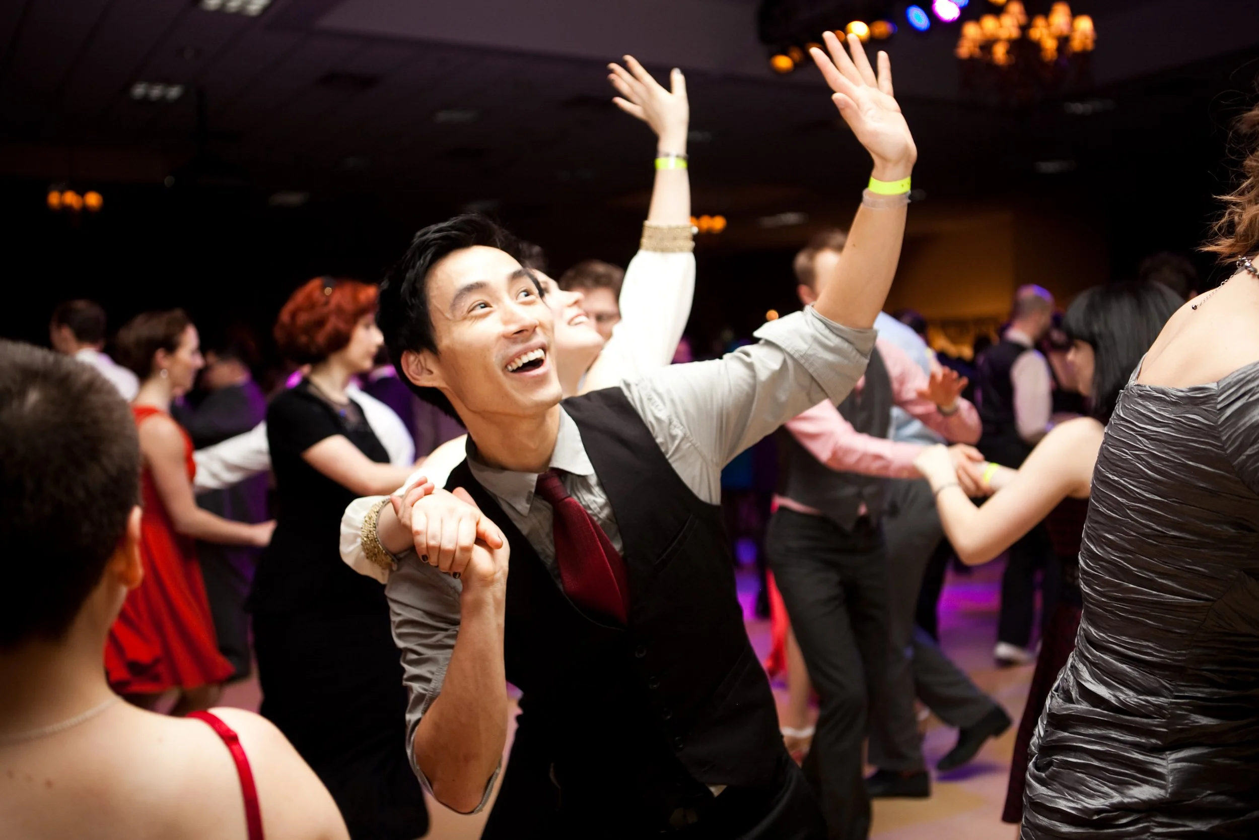 Dancers moving across the floor during a lively dance event in Lisbon, Portugal, captured by a professional event photographer. The energetic atmosphere, expressive movement, and vibrant social setting showcase the excitement of Lisbon’s dance and cu