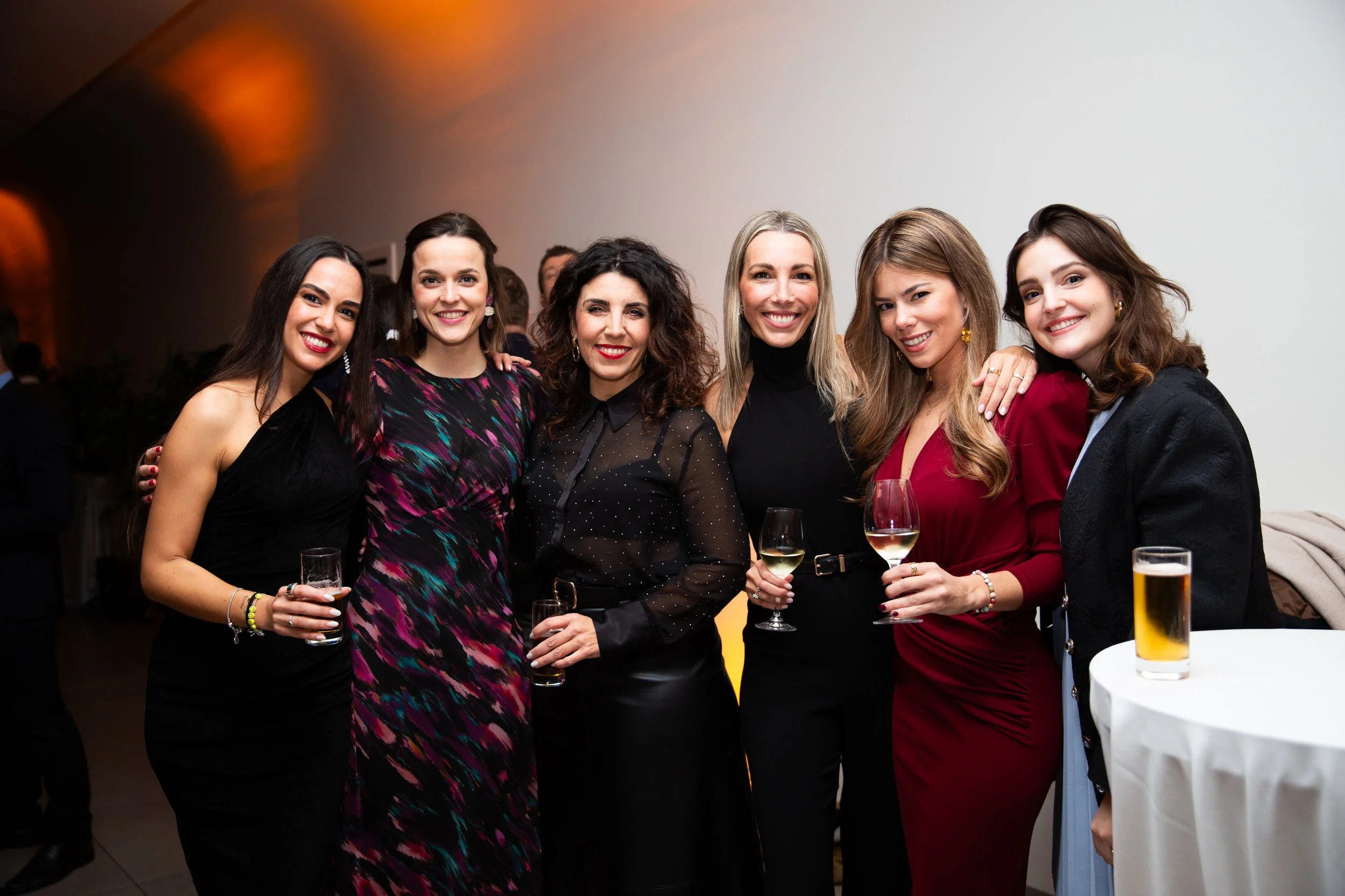 Professional corporate event photography in Lisbon, Portugal, capturing guests networking and connecting at a business event. This candid event photograph highlights the energy, connections, and memorable moments of a corporate gathering, making it i