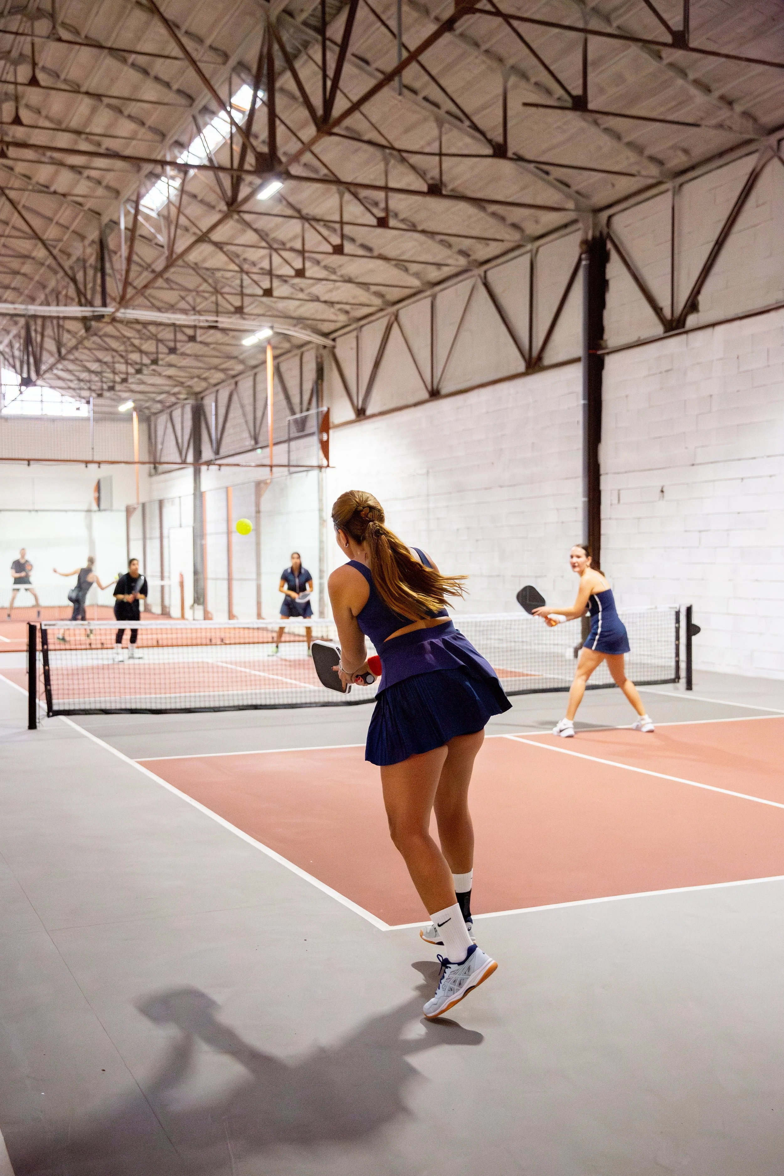 Professional pickleball photography capturing the excitement and energy of a league event in Lisbon, Portugal. From intense matches and competitive rallies to team spirit and community connections, these photographs tell the story of the pickleball e