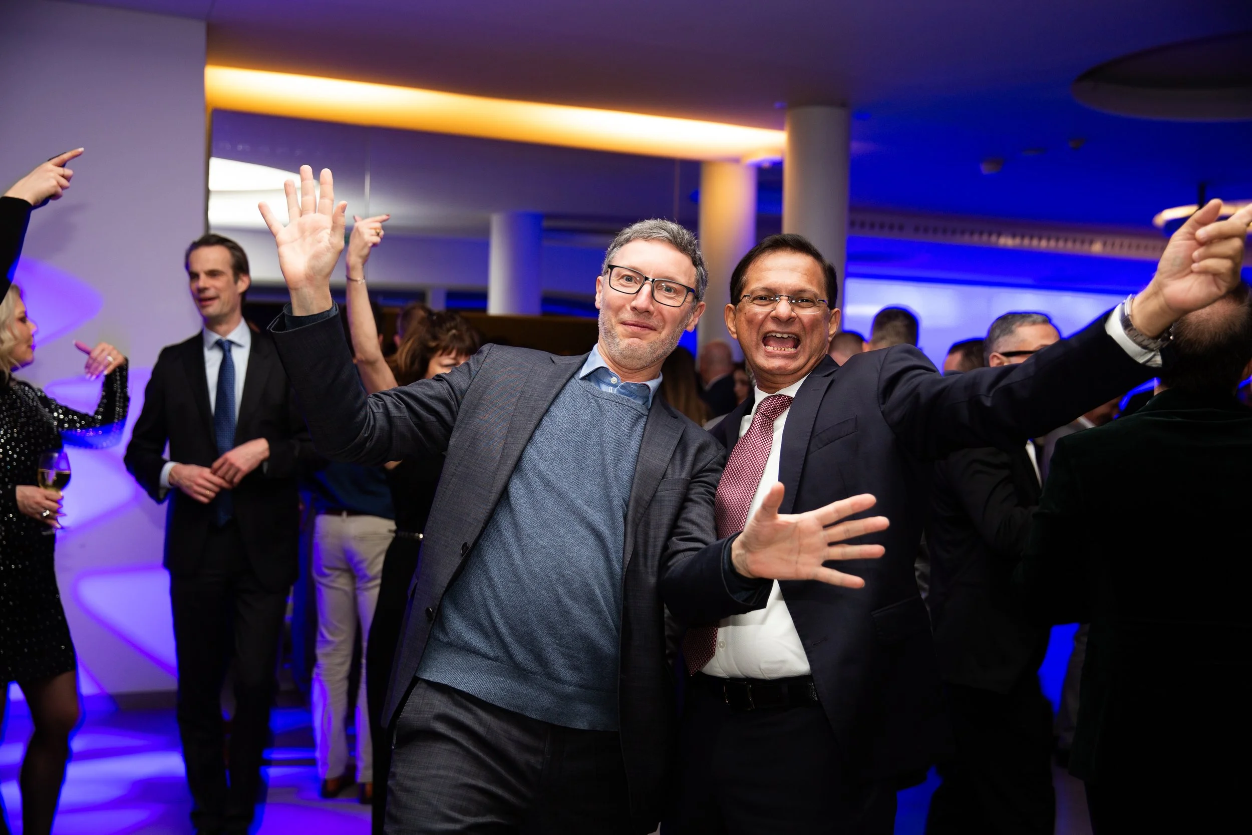 A professional photograph captured at a corporate event in Lisbon, Portugal, showcasing guests networking and enjoying the atmosphere of a business gathering. Lisbon corporate event photography captures genuine moments, professional connections, and 