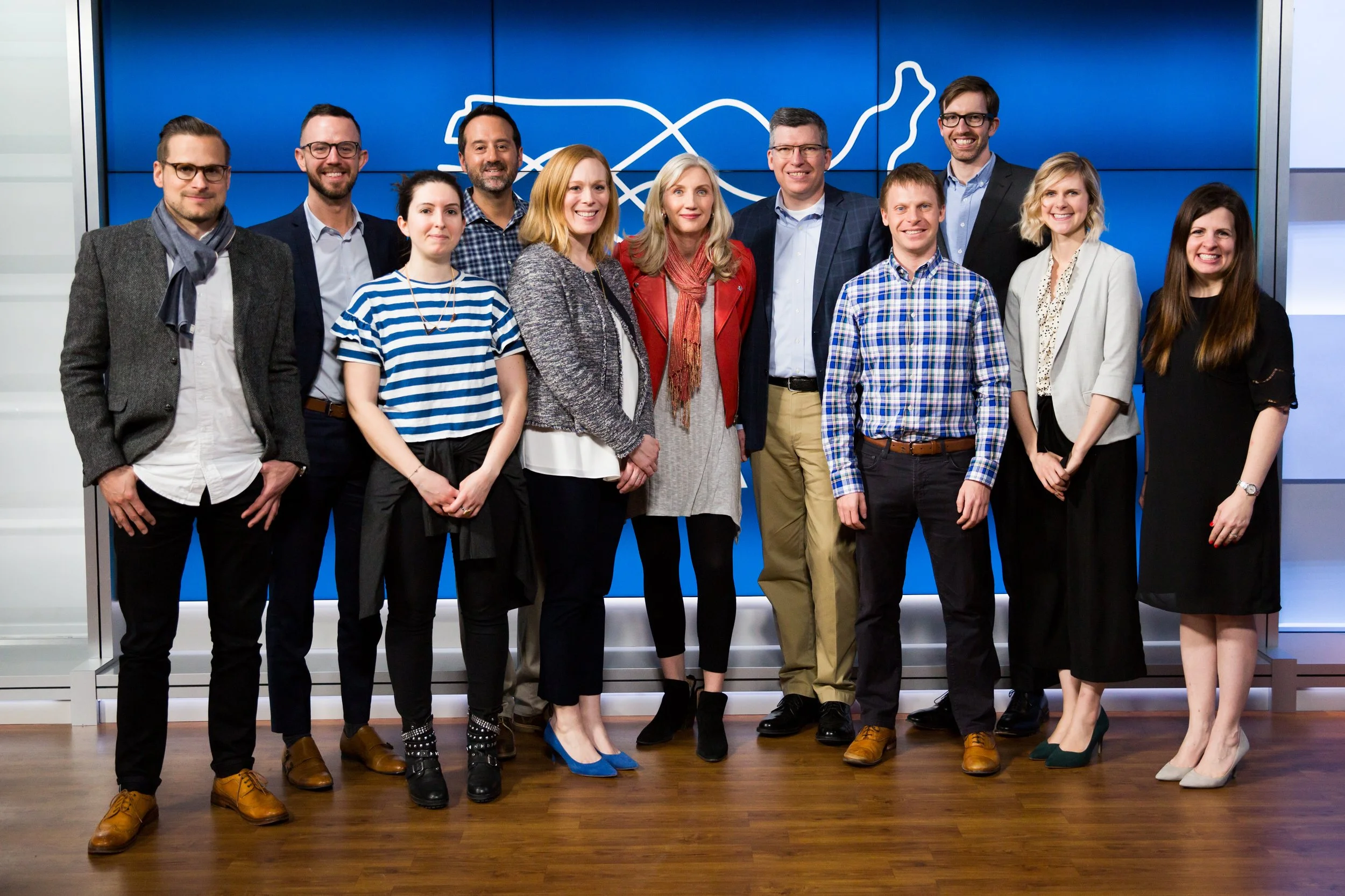 Professional corporate event photography in Lisbon, Portugal, capturing guests networking and connecting at a business event. This posed group event photograph documents the people who made the event possible.