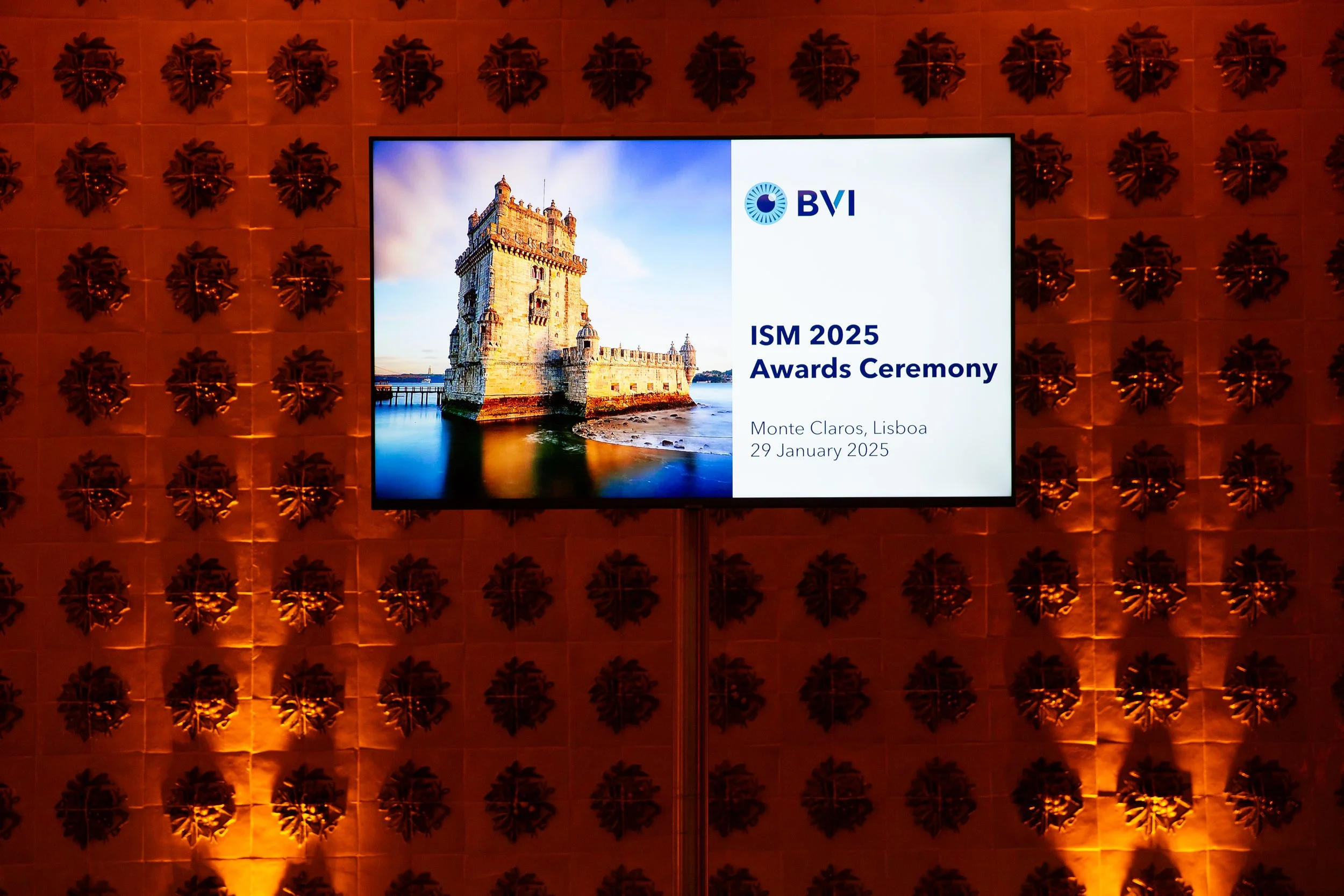 Professional corporate event photography in Lisbon, Portugal, featuring a branded event sign showcasing a company’s logo and visual identity. This image highlights the importance of cohesive branding and professional presentation at business events, 