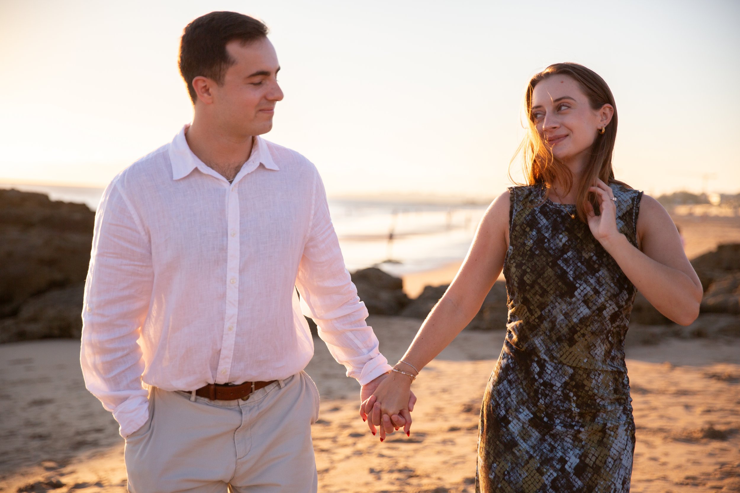 Romantic Oeiras beach engagement session at Praia do Moinho during sunset.