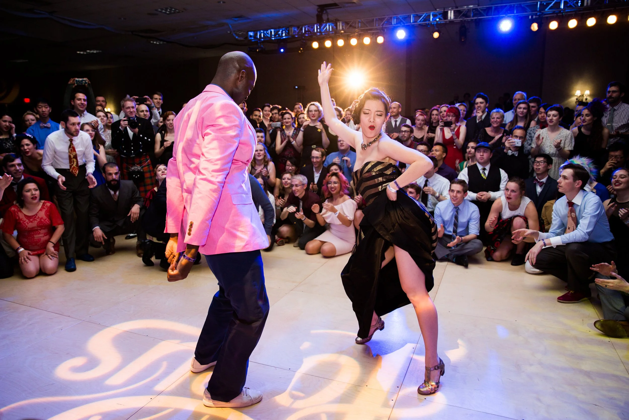Dancers moving across the floor during a lively dance event in Lisbon, Portugal, captured by a professional event photographer. The energetic atmosphere, expressive movement, and vibrant social setting showcase the excitement of Lisbon’s dance and cu