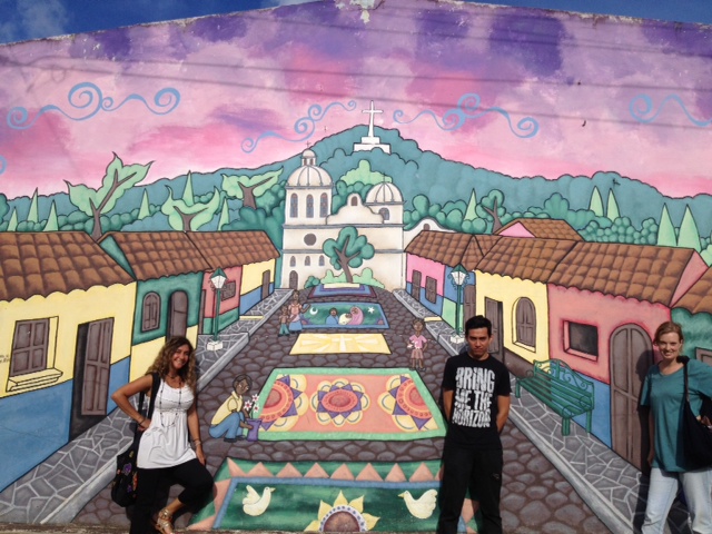 One of the many beautiful murals in El Salvador with Carlitos.