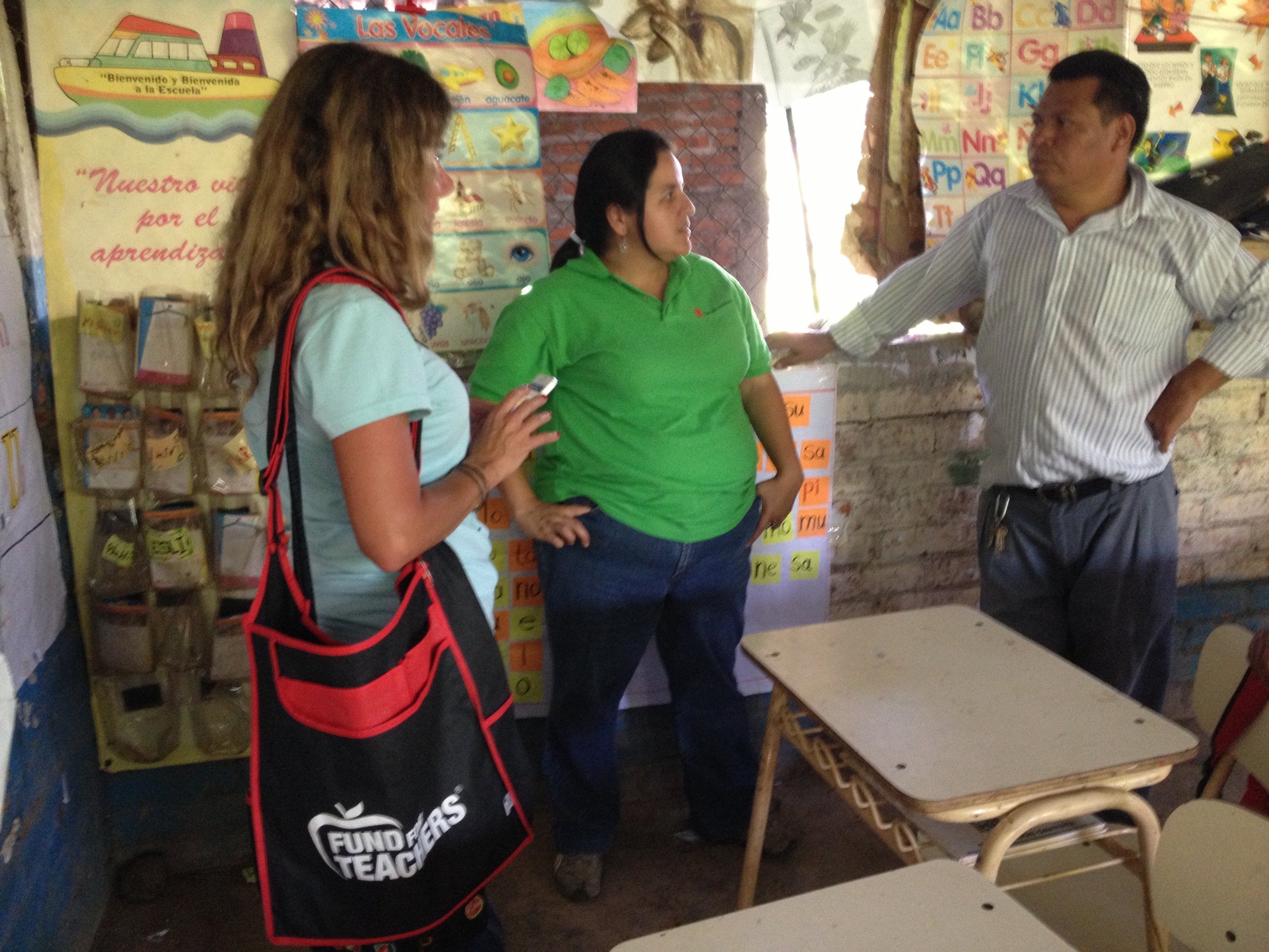  Talking to a teacher with a Save the Children worker in the country near the Honduran border in El Salvador. 