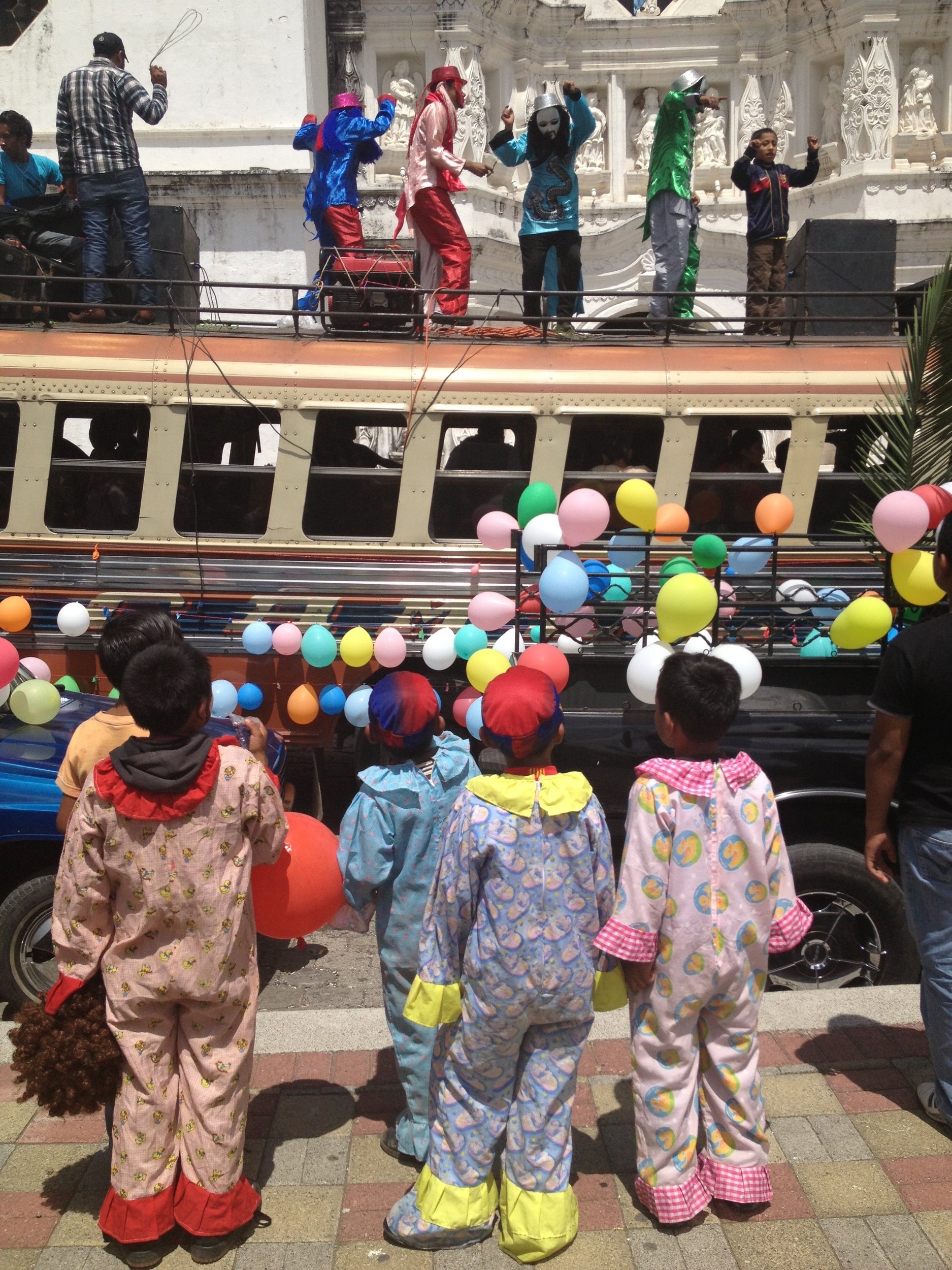  Little clowns watching a St Christopher day parade. One of the dozens of parades we enjoyed in Central America. 