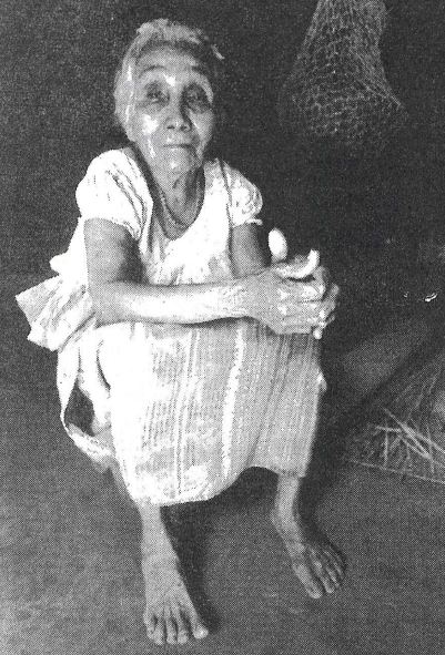 Photo: Sonsonate, El Salvador. This 90-year-old woman lost most of her family members in the Matanza of 1932. She not only survived, but was one of the few to resist assimilation into the Spanish creole culture. She speaks Nahuatl. The fabric in her skirt is from Guatemala. There are no longer weavers who make traditional huipiles or dress in El Salvador. © Donna Decesare, 1990. 