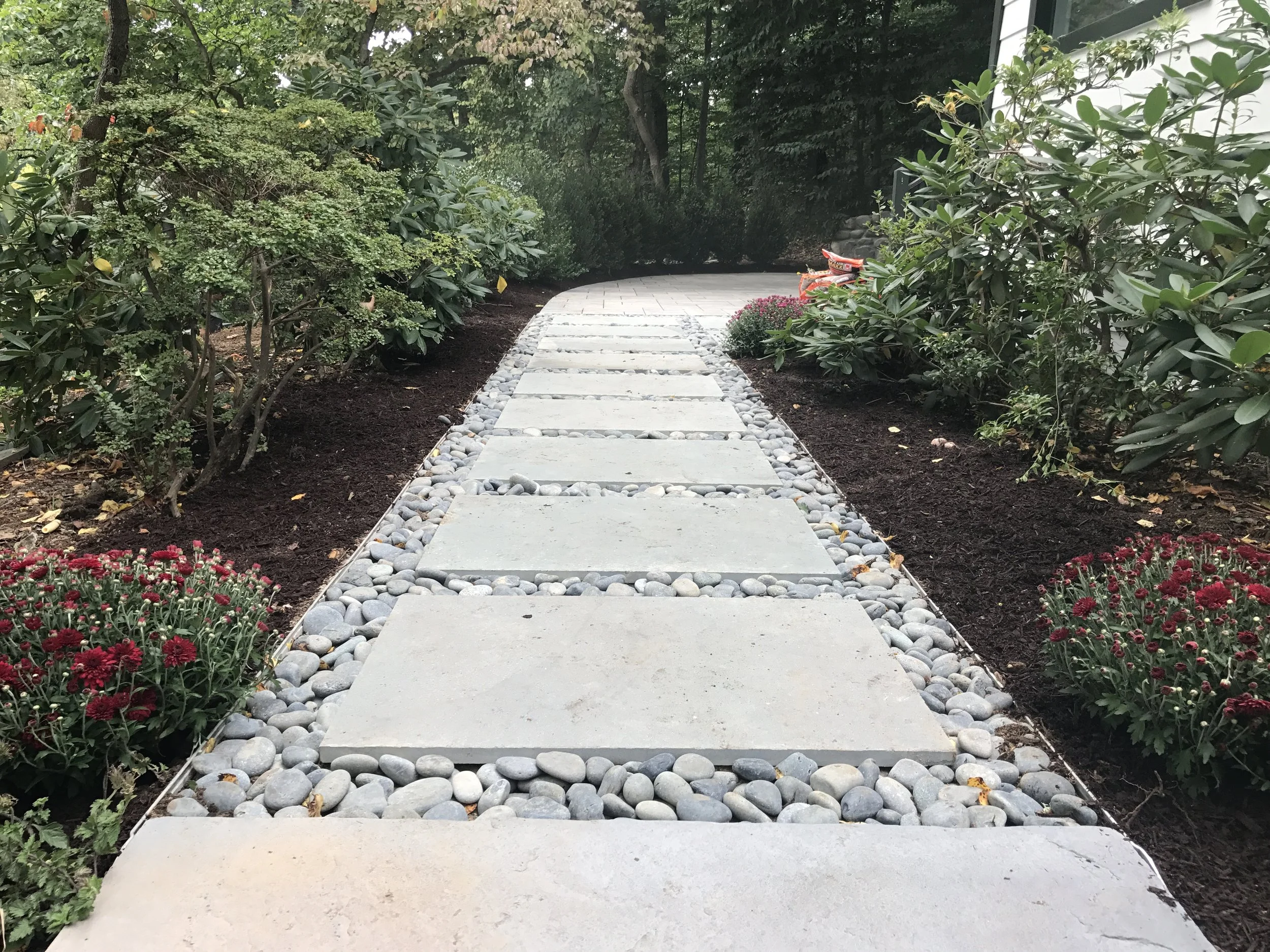 Add Style to Your Paver Patio and Walkway with Pebbles and Rocks in Melville, NY — Above All Masonry