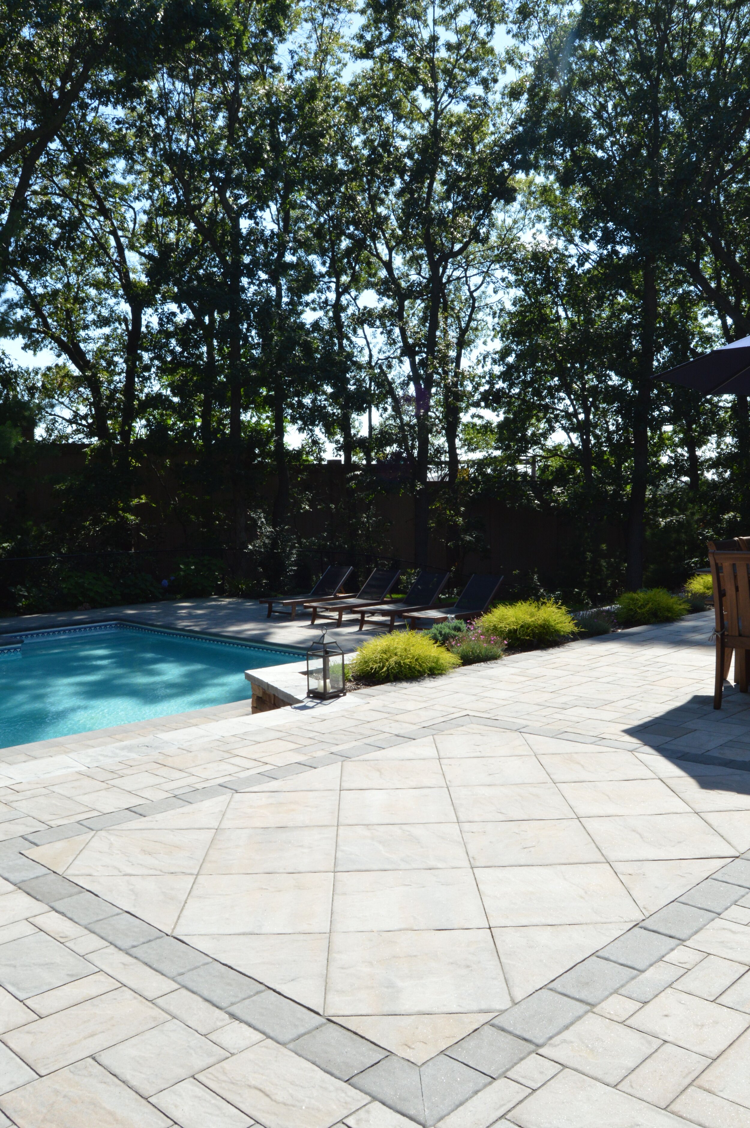 Why Every Landscape Design Could Use a Swimming Pool in East Northport