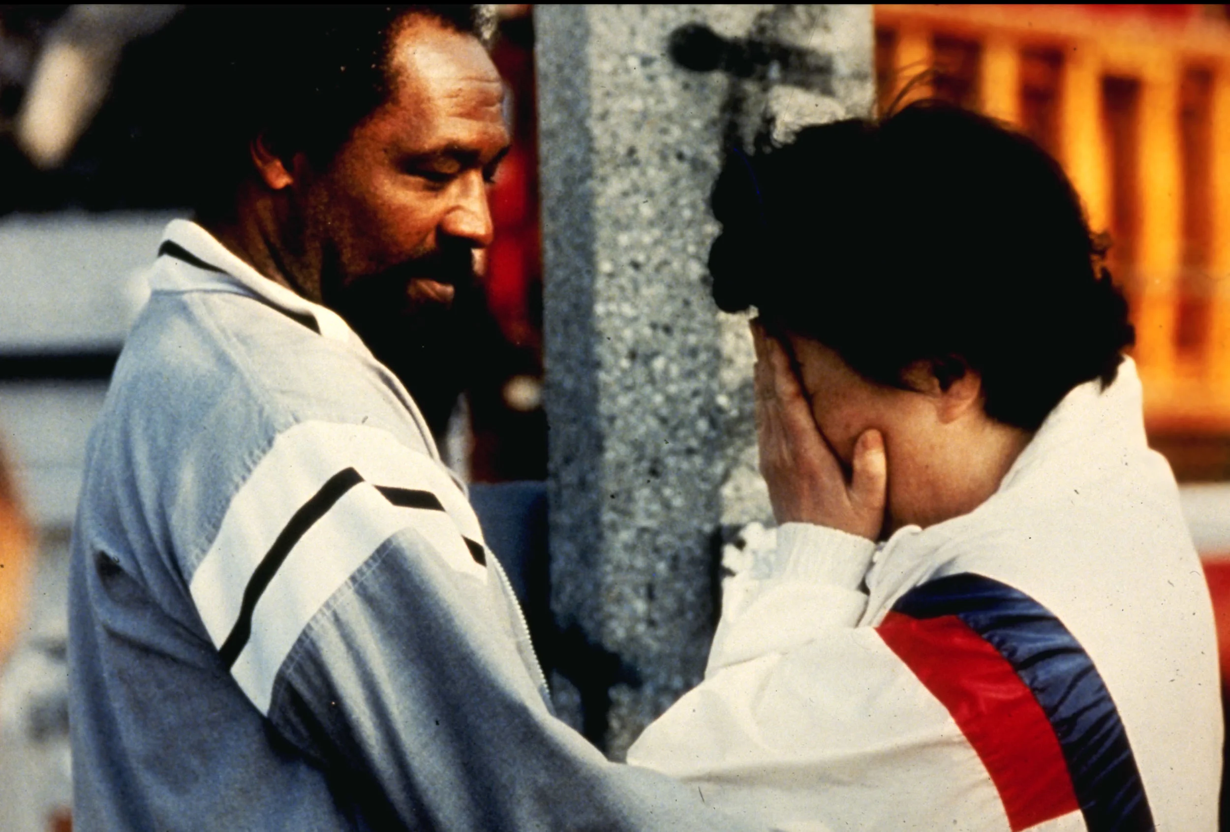 A Korean store owner is comforted by a local resident after she returned to find her place of business looted and burned in south-central Los Angeles, April 30, 1992, during day two of the Los Angeles riots. (Photo by Steve Grayson/WireImage) 2002 Wireimage