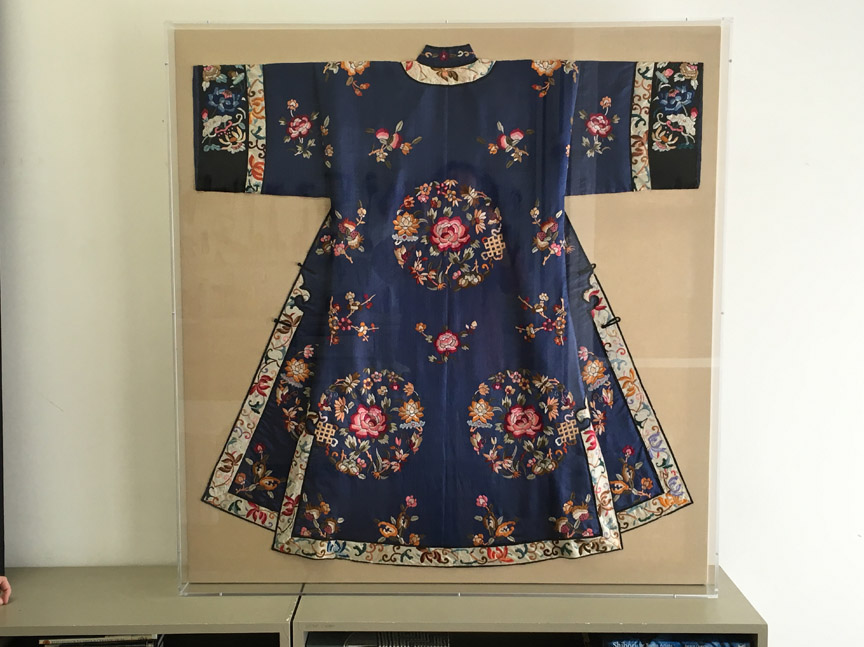 Chinese robe, mounted on linen and encased in an acrylic frame. 