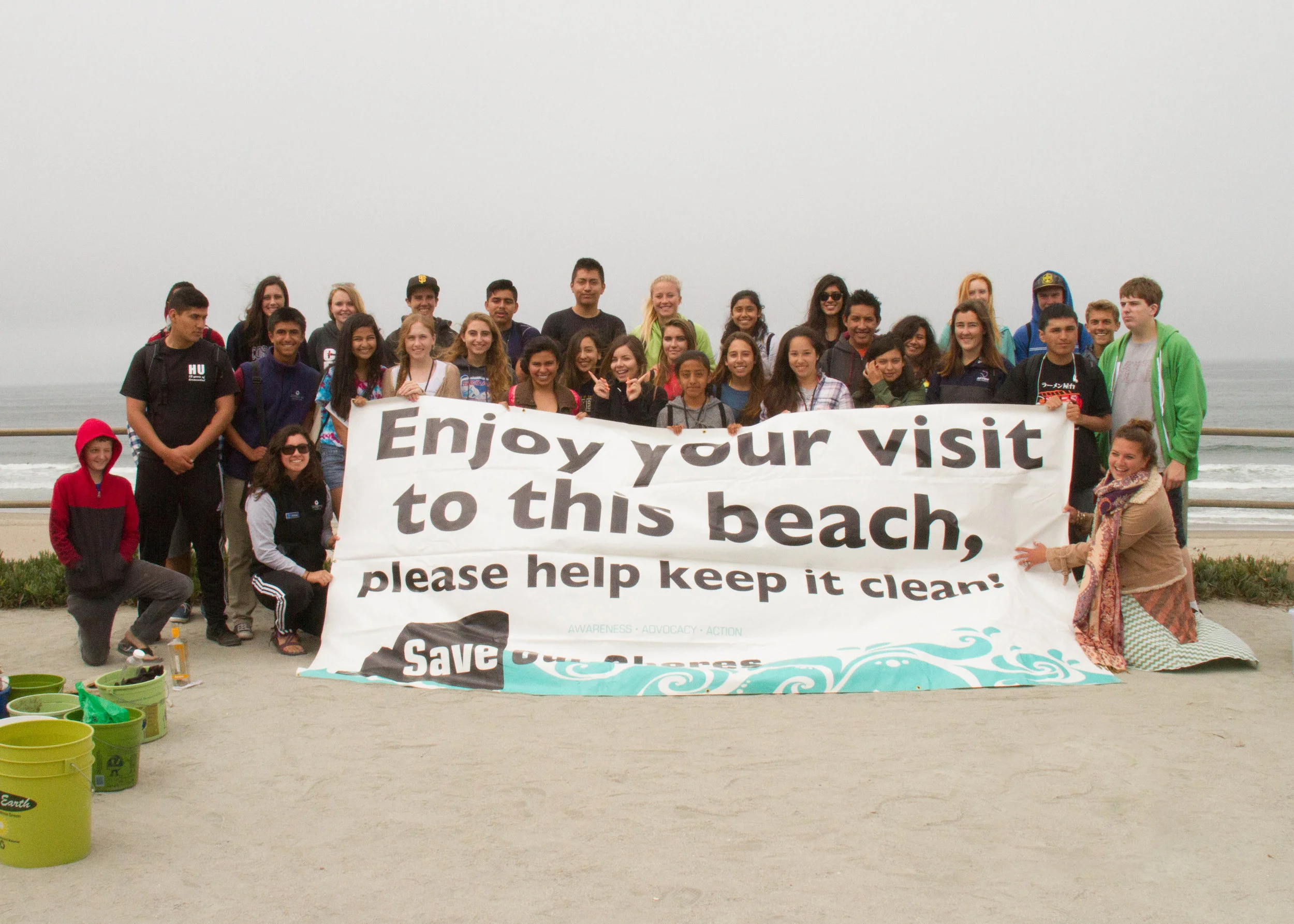 Students participate in a Save Our Shores beach clean-up. By collaborating with WOLF School, Save Our Shores is able to reach a whole new sector of central California's youth, and WOLF School is able to integrate a deeply impactful lesson into their outdoor science school program.