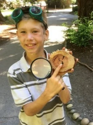 kid with wood.jpg