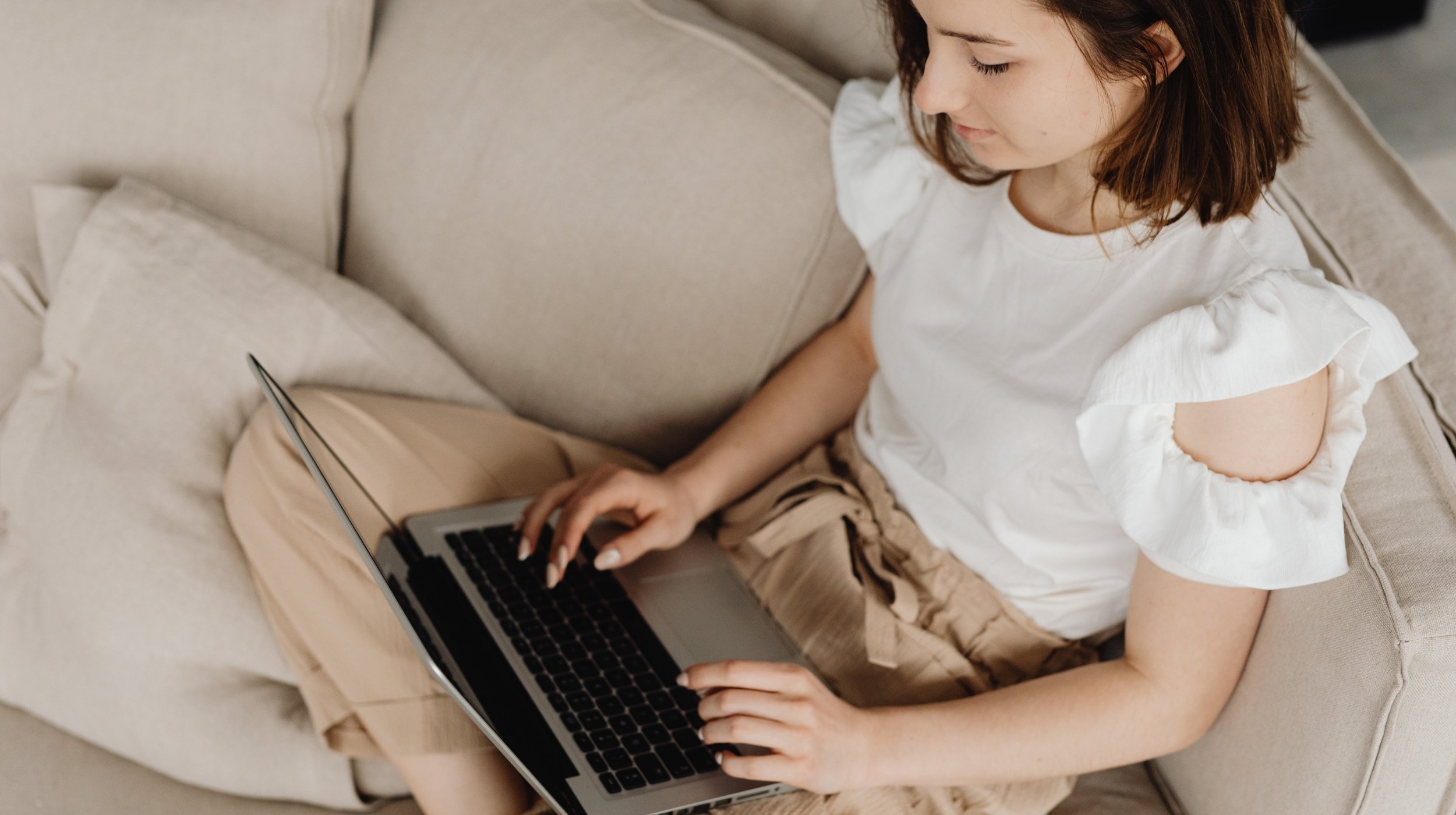 Teen girl using a laptop at home, representing virtual counseling and online therapy support.