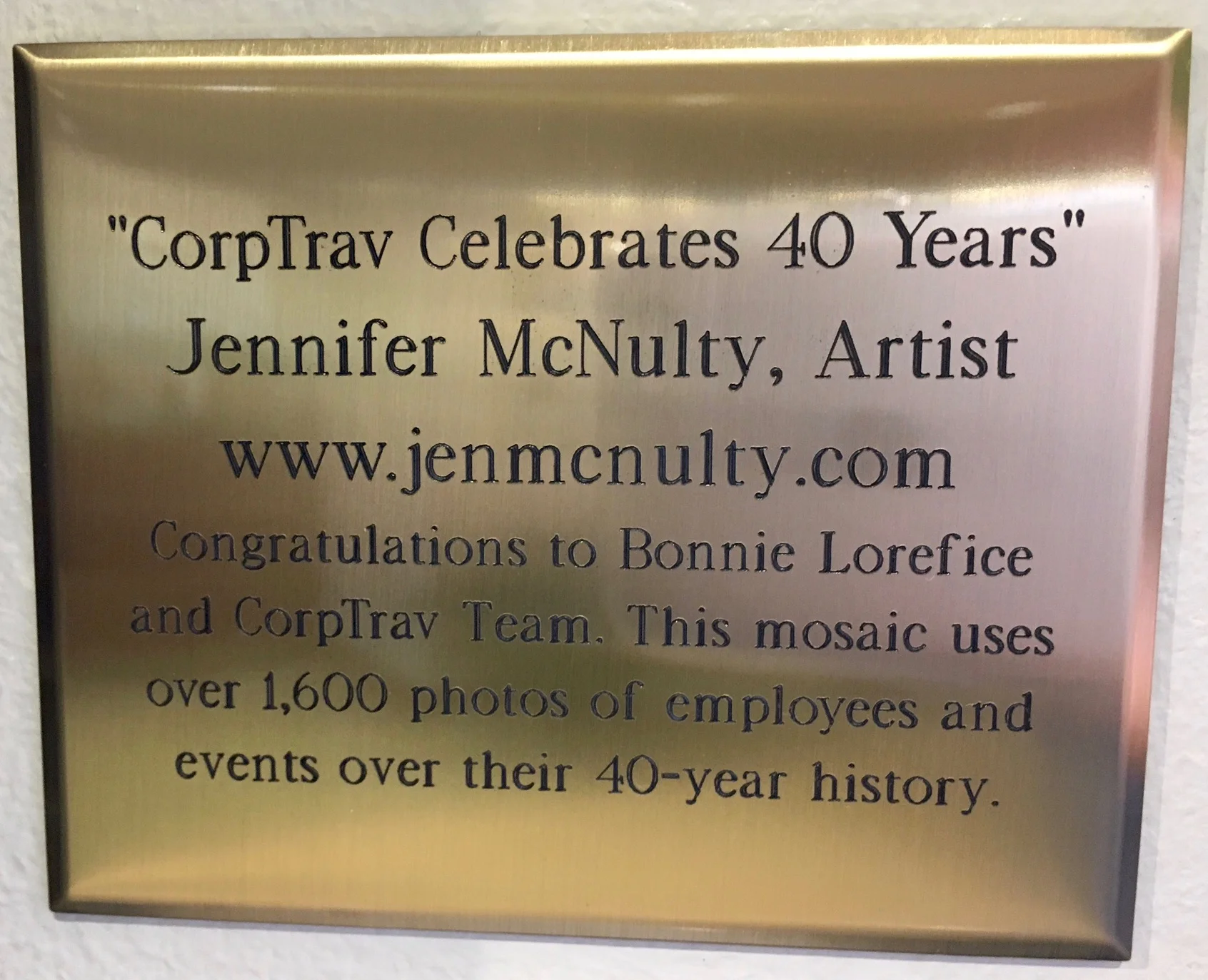   Plaque next to the mosaic in the CorpTrav lobby.  