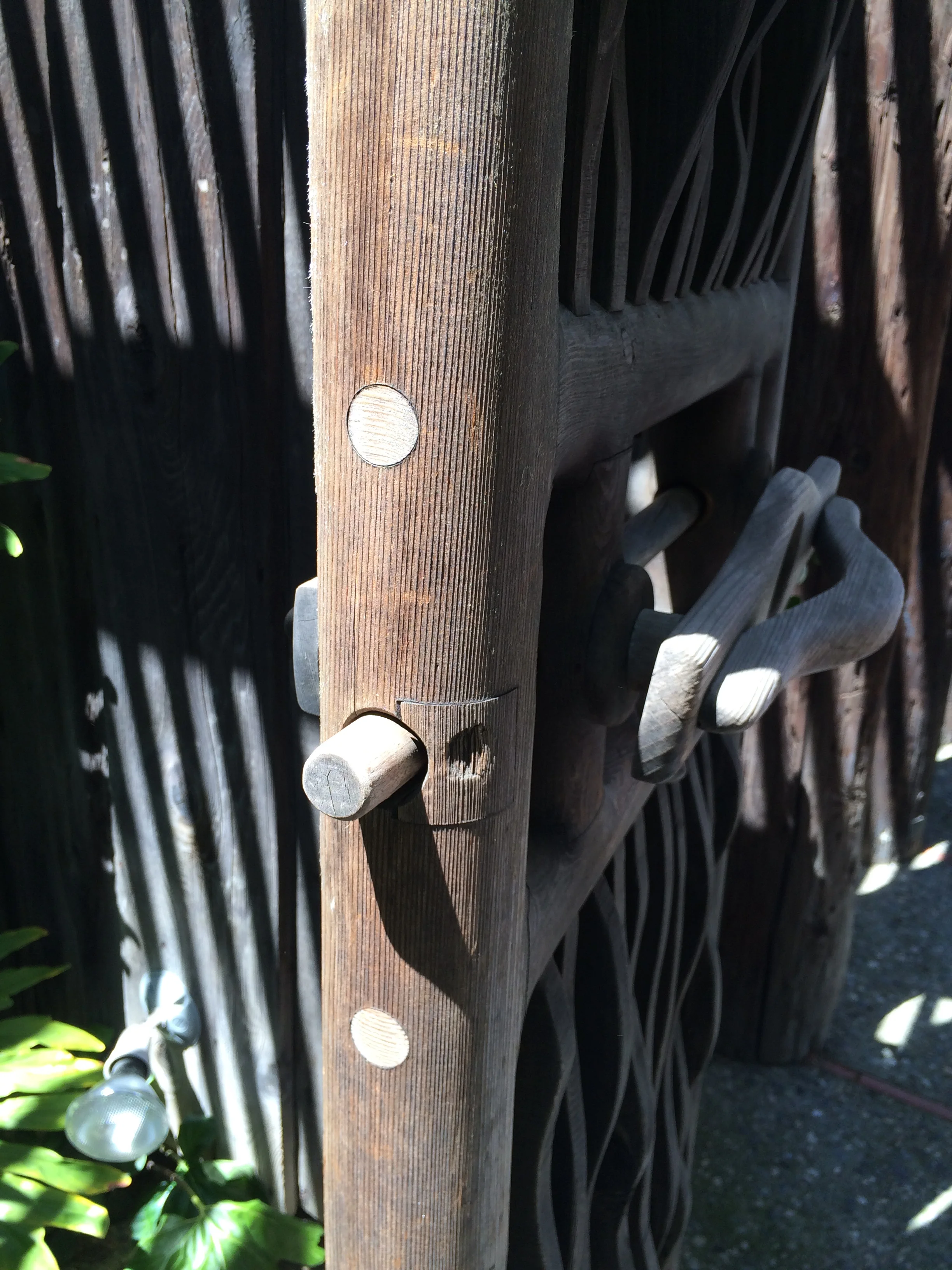 the ingenious latching mechanism. the gate is (I believe) redwood, and the pins are maple