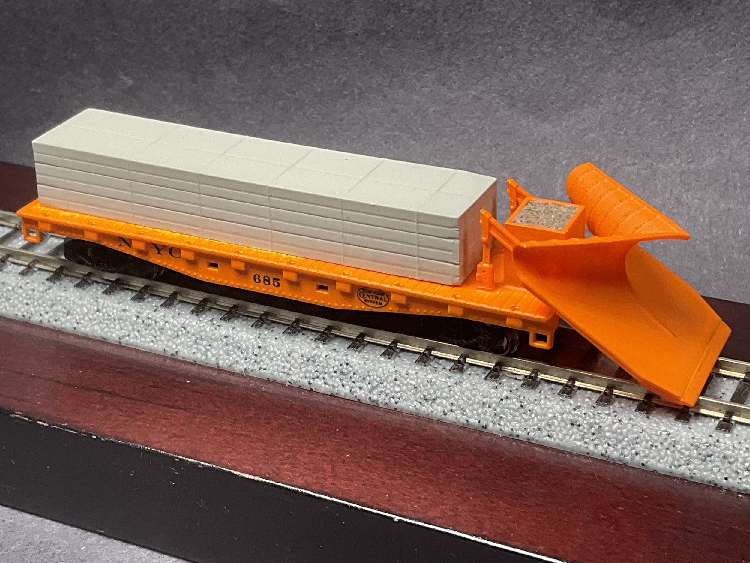 Image of an NYC fantasy Wedge Plow using a modified flat car and the Keystone Customs Push Plow kit.