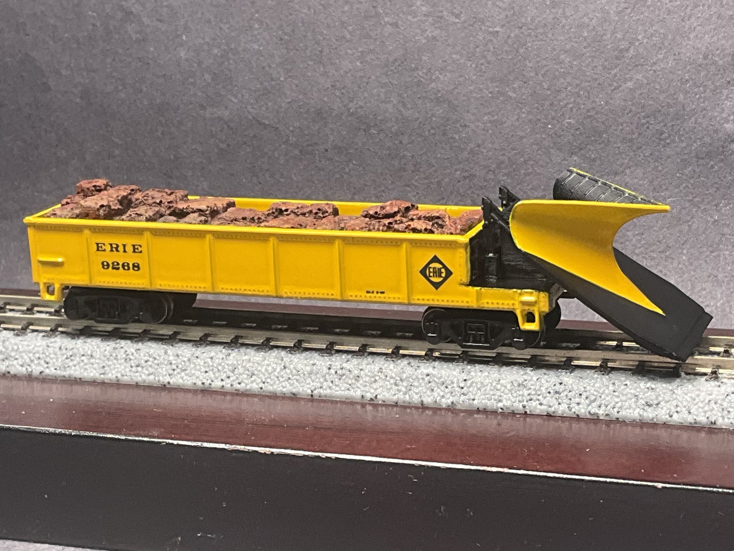 Image of an Erie fantasy Wedge Plow using a modified gondola car and the Keystone Customs Push Plow kit.