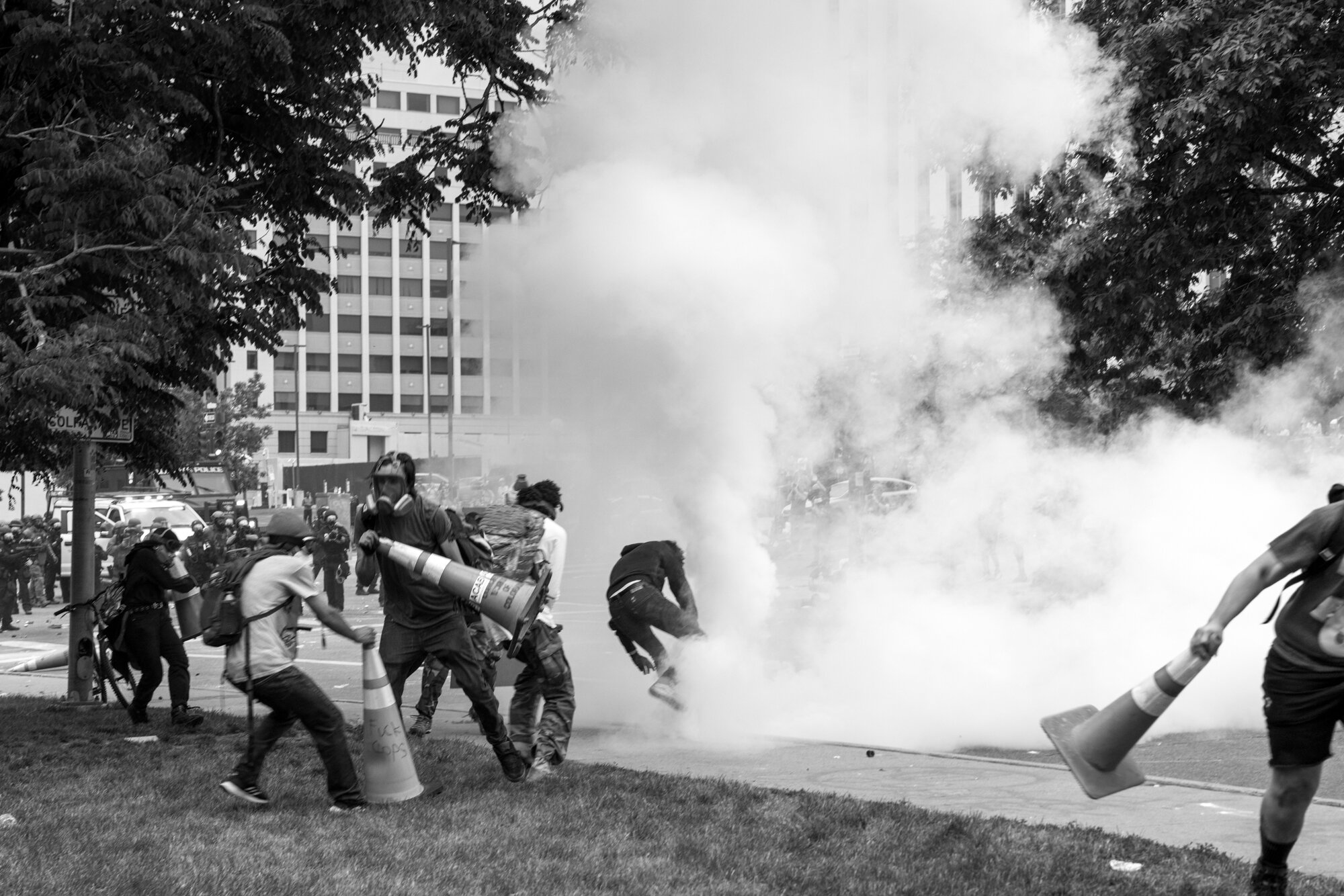 Protesters flee as Denver police fire an array of tear gas and rubber bullets. 5/30/2020.