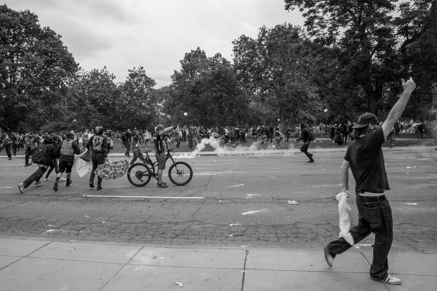 Protesters react after police just shot a tear gas canister towards them. 5/30/2020.