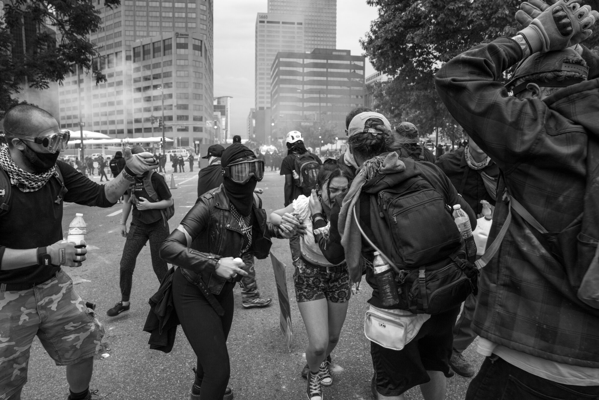 Protesters tend to a woman crying after police started firing rubber bullets and tear gas. 5/30/2020.