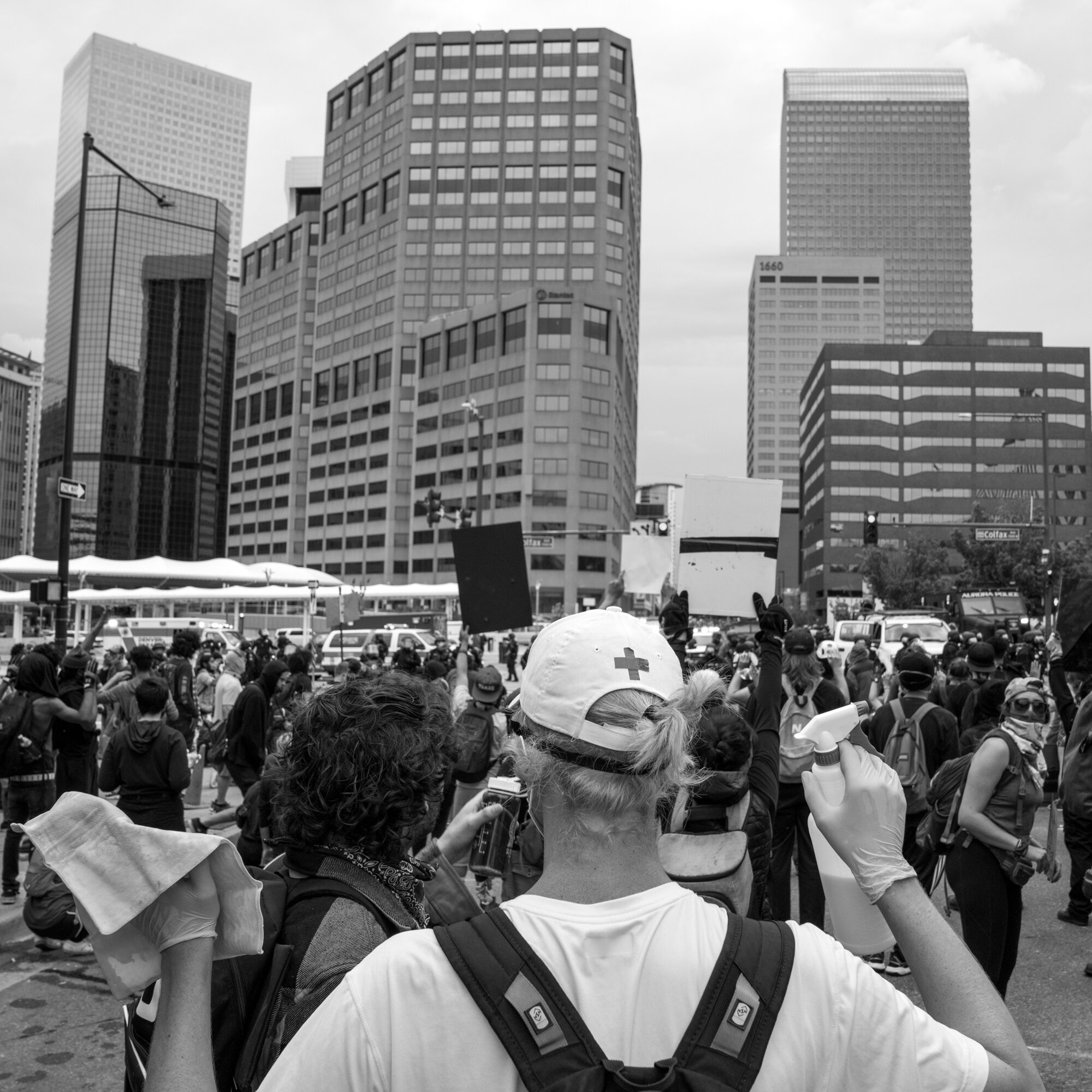 A medic holds up a towel and a bottle of tear gas / pepper spray combatant. 5/30/2020.