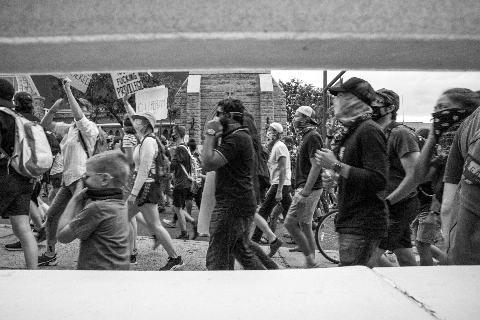 A group of masked protesters continue their march. 6/02/2020.