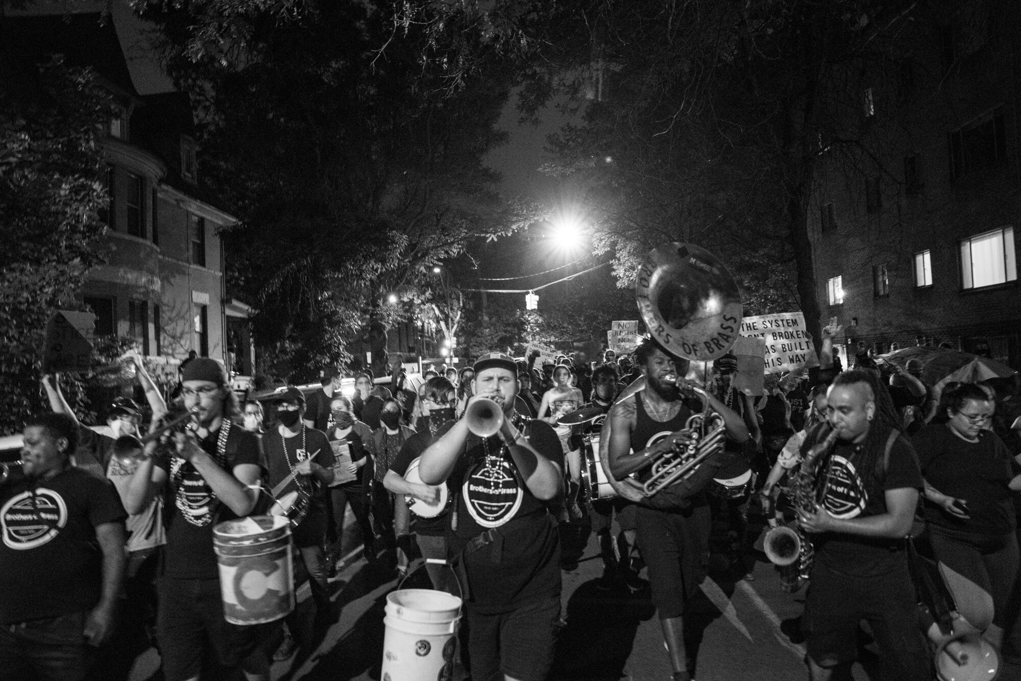 The Brothers of Brass Band marches and plays music along with the protesters on their way to the police station. 6/02/2020.