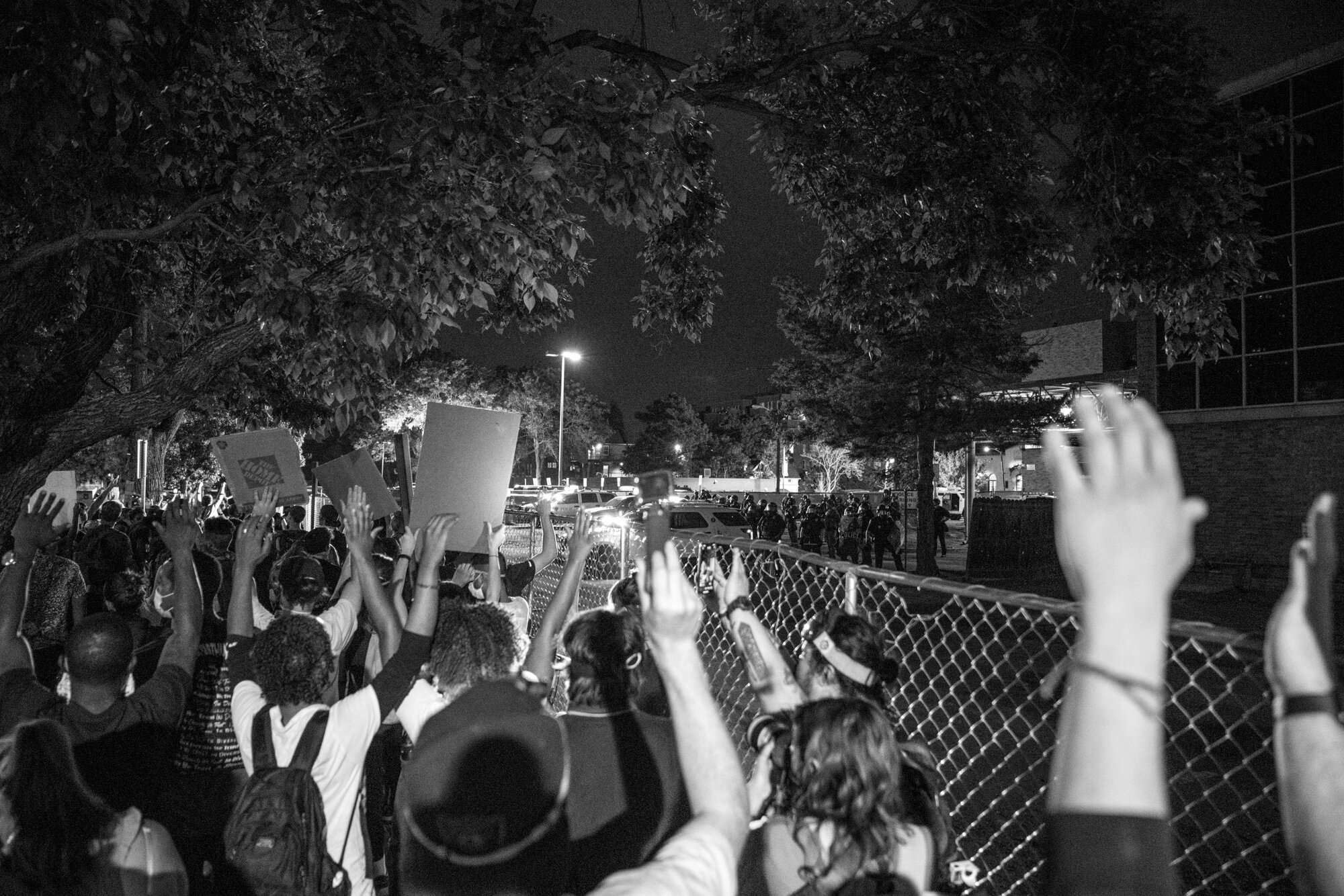 Protesters put their hands up outside of the police station. 6/02/2020.