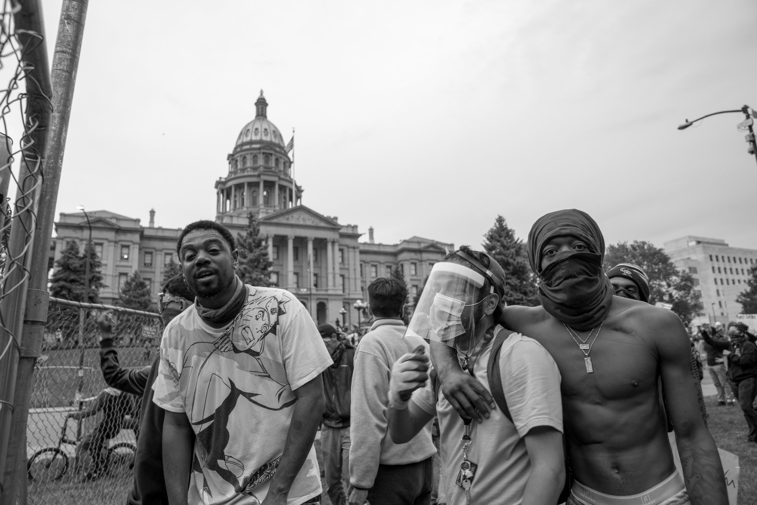 Protesters shout from behind the newly constructed fence just after the curfew started. 5/30/2020.