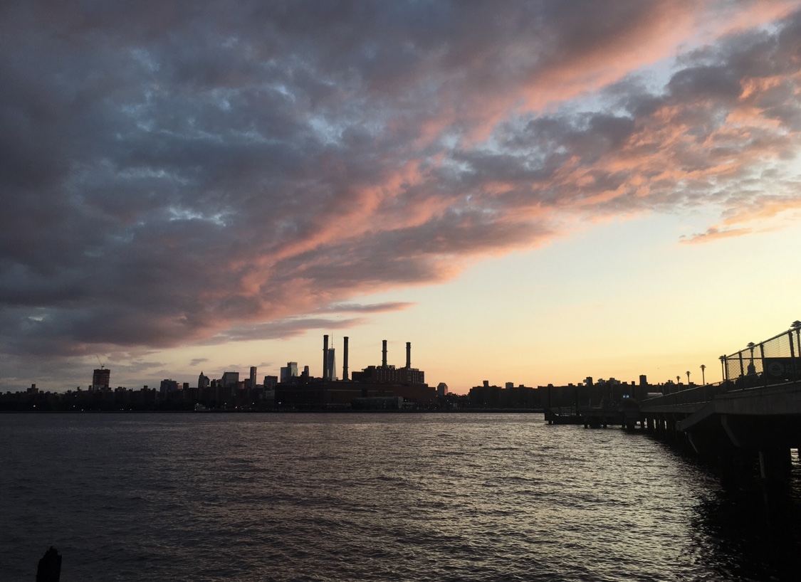 Manhattan view at sunset at the East River in Greenpoint, Brooklyn as my friend and I fed stray cats the neighborhood is trying to rescue from developers