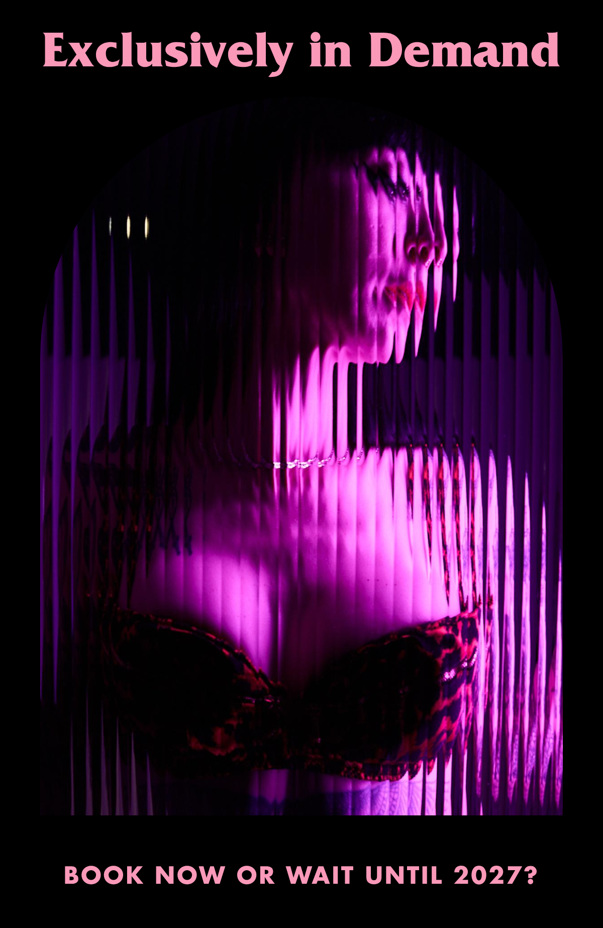 Ramona Ryder is wearing lingerie standing behind wavy glass that is distorting her face and body.