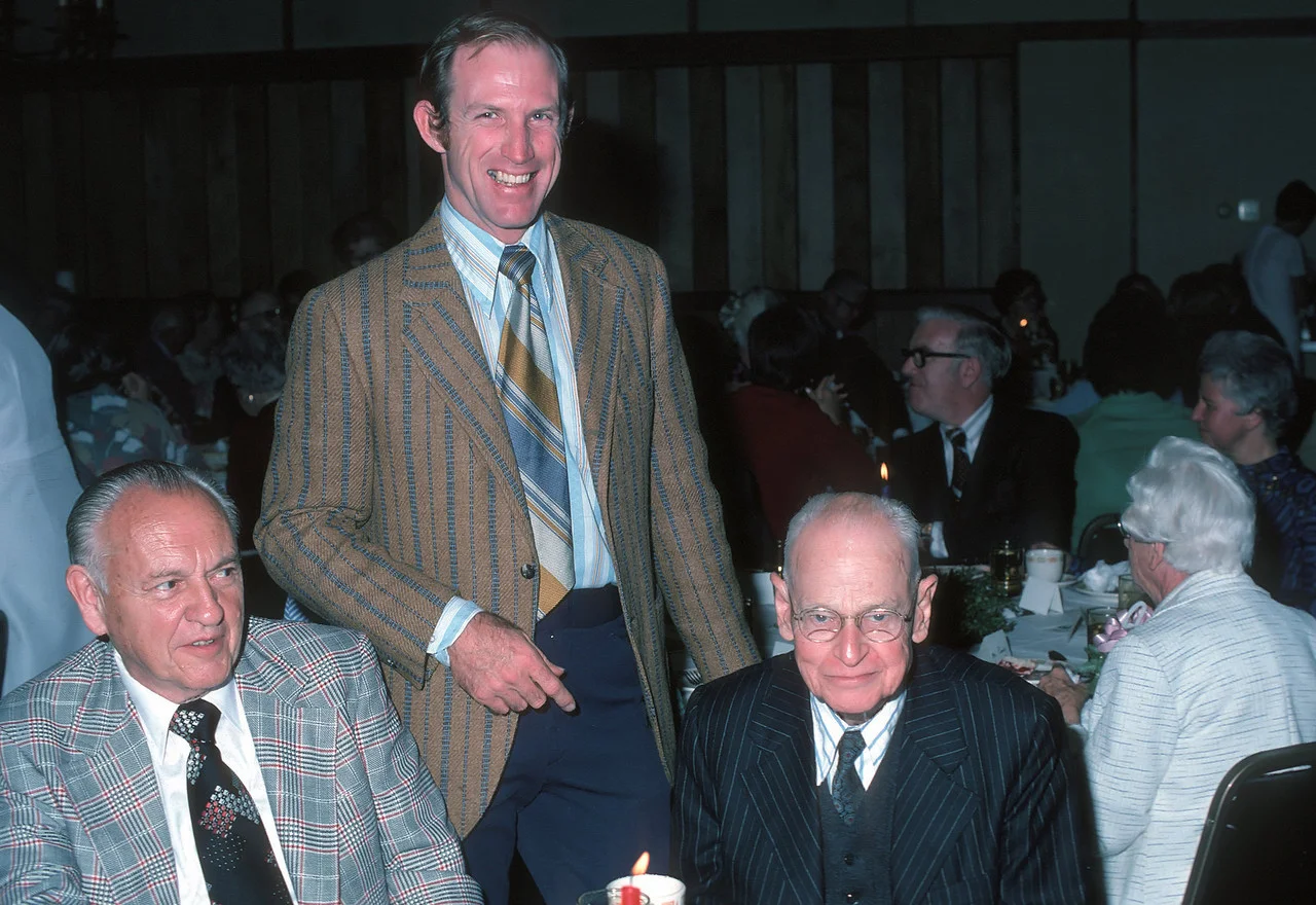 Wayne Wever '65 standing next to Donald Fullerton '13 seated