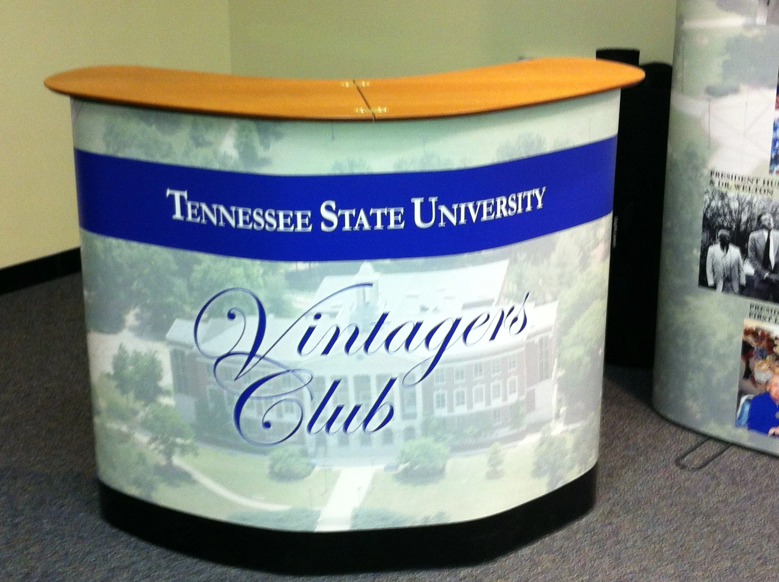 Counter with front graphics, maple top and storage, TSU