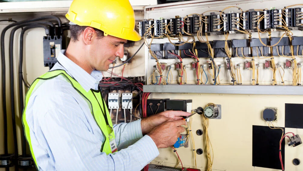 services-electrical-contracting-electrician-at-panel.jpg