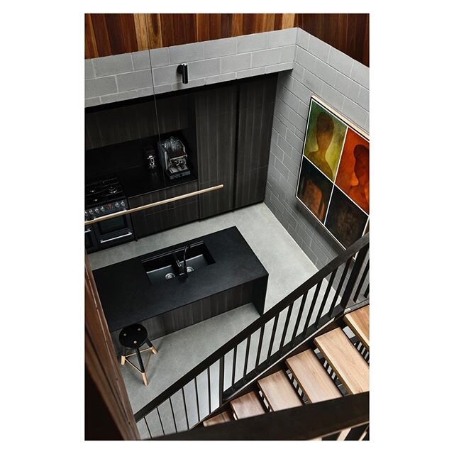 WICKHAM HOUSE
Kitchen and stair void, soft light filters down from a long linear skylight above. 
The open and central staircase encourages incidental interactions between the kitchen and living areas. .
.
Built by @justingeebuilding 
Photo by @derek