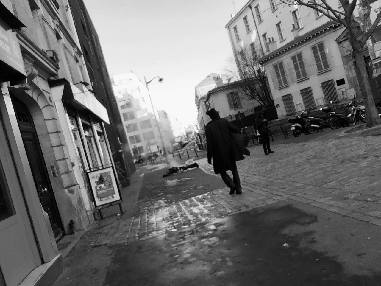 man_walking_lying_on_street_december_2017.jpg