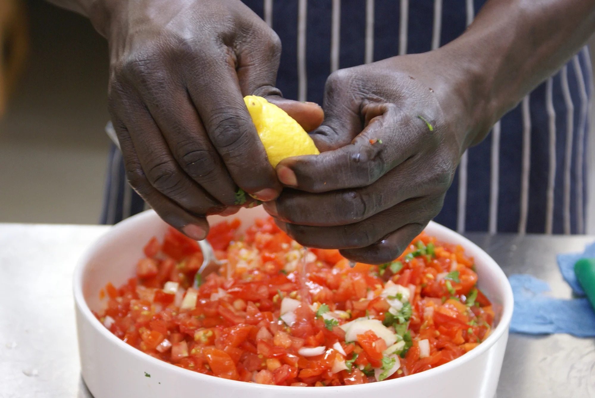 2016-sudanese-tomoto-salad-lemon-hands-kent.JPG