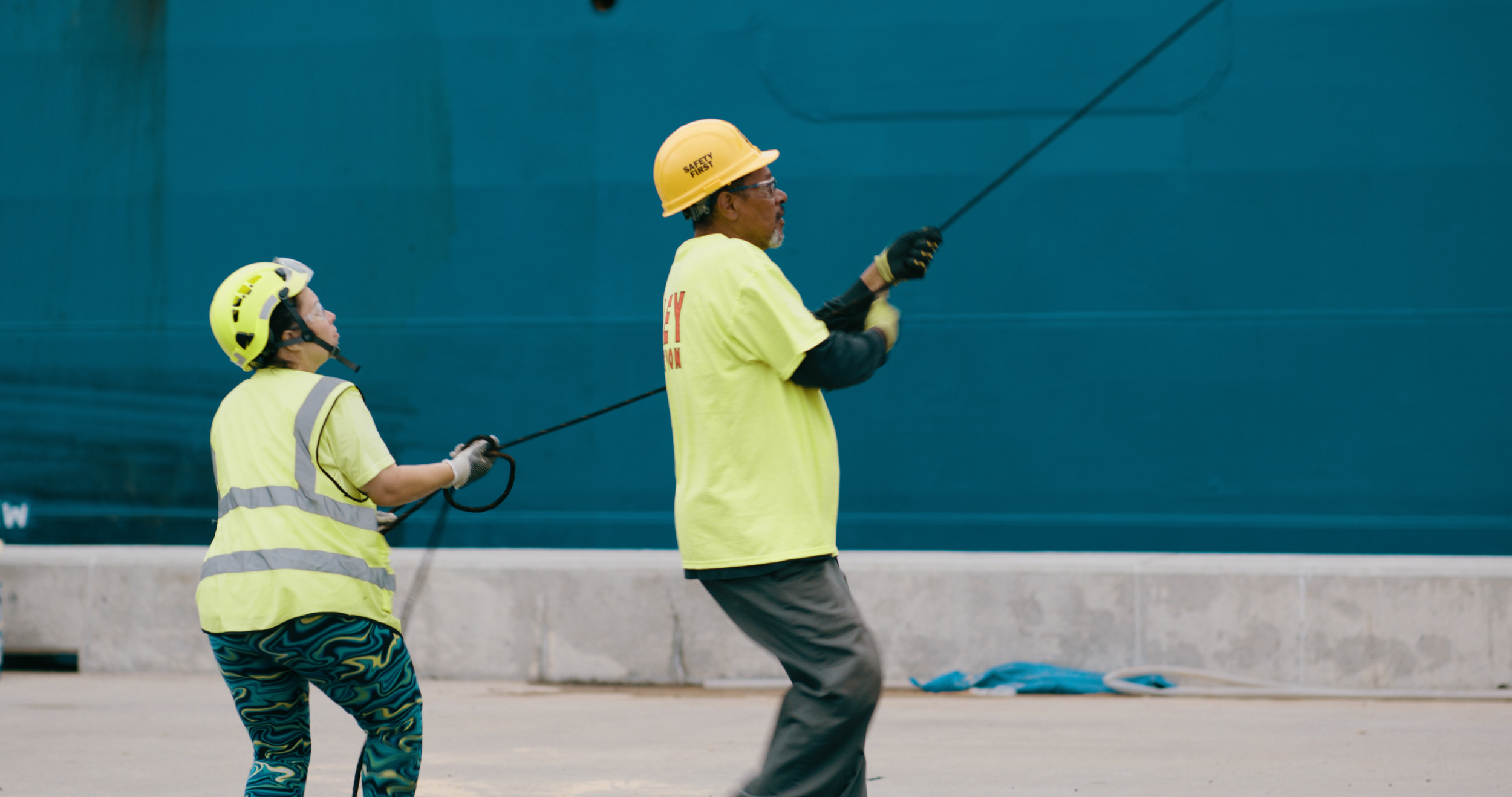 Two employees work at the Port of Davisville.