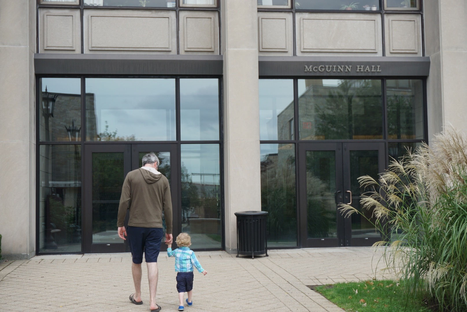 Leo and his Dad walk to McGuinn Hall from the Beacon Street Entrance.