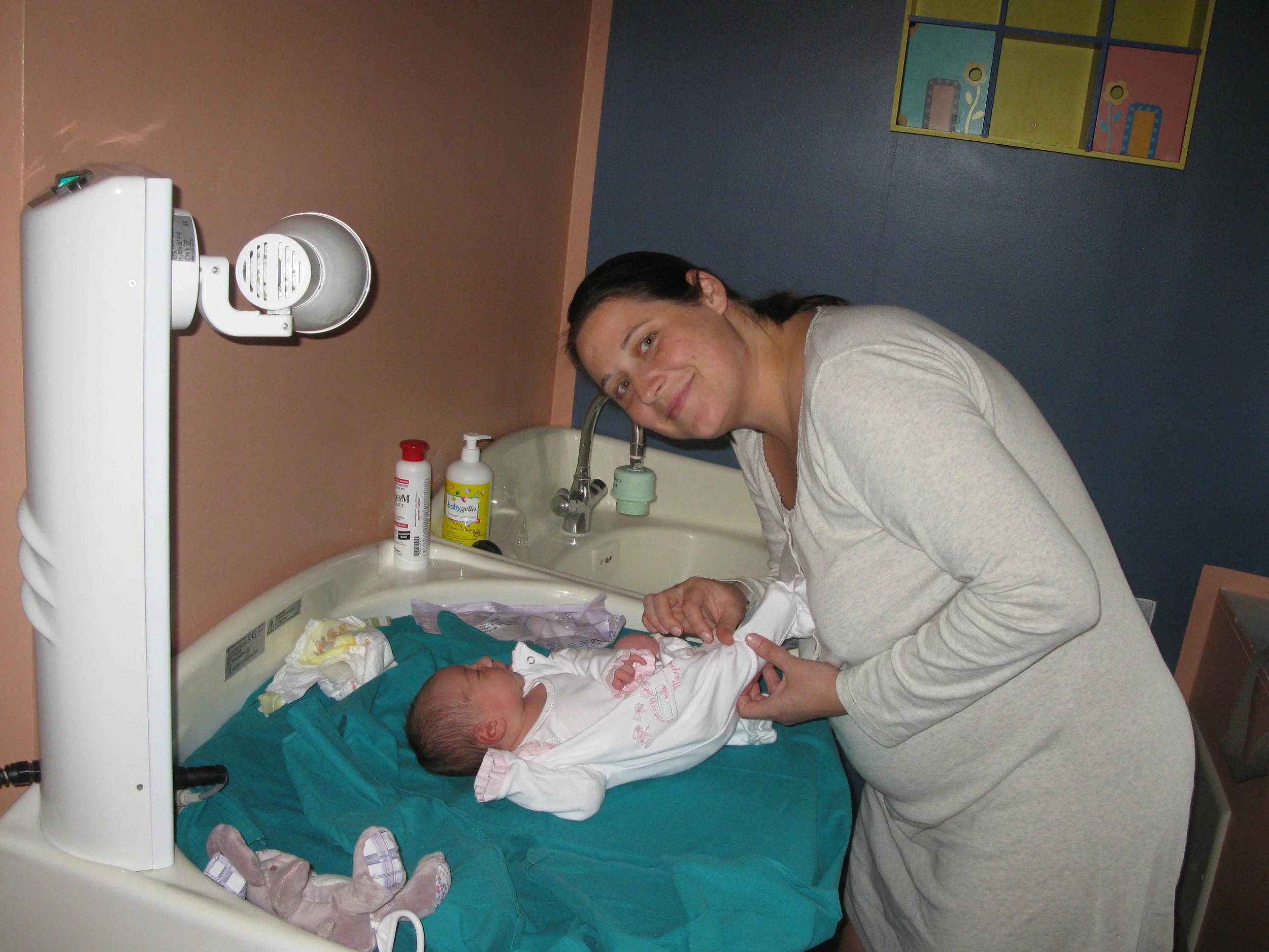 This heated changing table was in my private room. Diapers, soap, and cream were provided by the hospital. Mothers wear their own clothes and bring clothes for the baby. The cost of birth is covered by the Italian public health system.