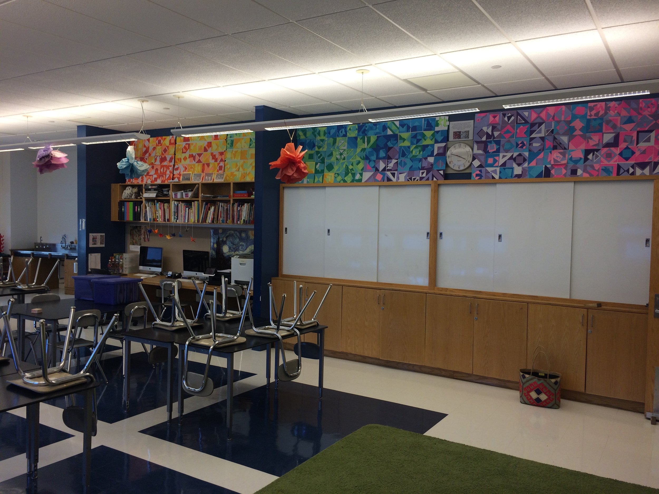 I display murals from previous years above my shelving. 