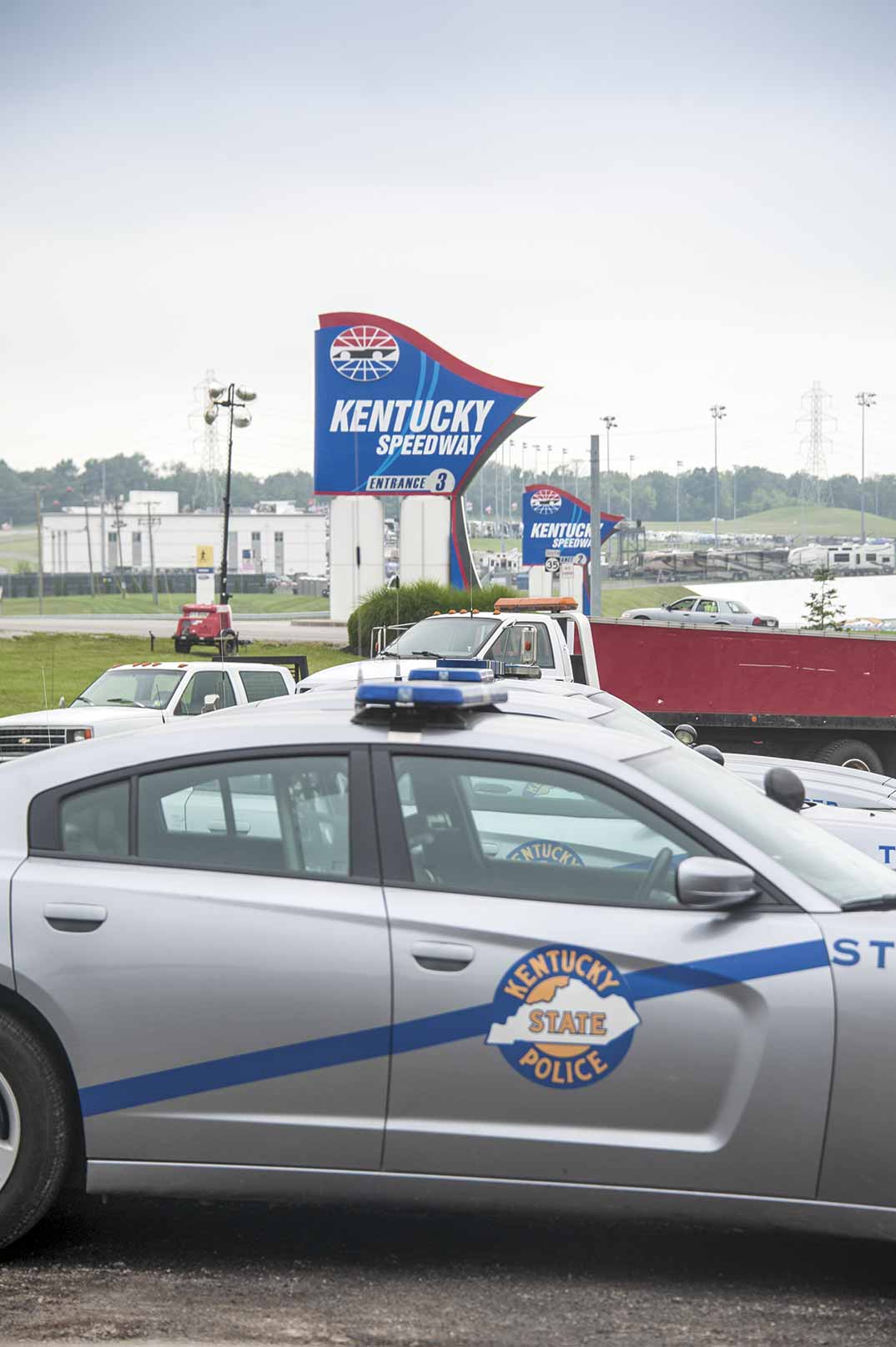  The Kentucky Speedway adds additional challenges to the Gallatin County Sheriff’s Office. Each year approximately 80,000 people flood the speedway and surrounding campgrounds. (Photo by Jim Robertson) 