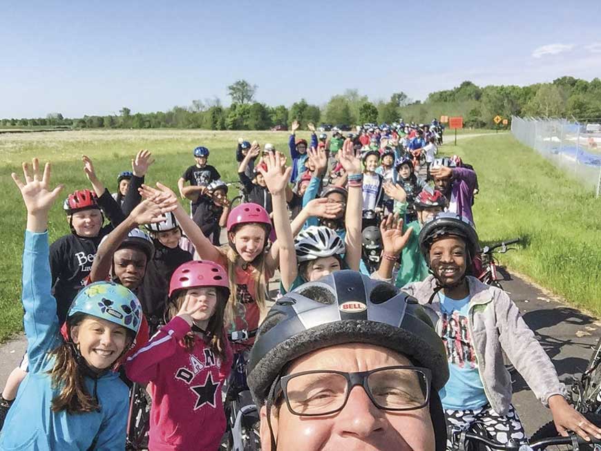 Nearly 200 fifth graders from Ashland Elementary in Lexington biked the Legacy Trail with Lexington Police Officer Howard Florence during a May field trip. (Photo submitted)