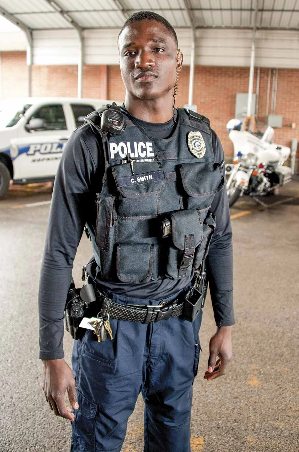 Hopkinsville Police Officer Cory Smith, one of the agency’s newest K-9 handlers, also wears an external load bearing vest. The police department sought this particular style of vest for their officers in an effort to reduce the cost associated with officer injuries and fatigue as well as to promote a healthier environment and increase officer wellbeing. (Photo by Jim Robertson)