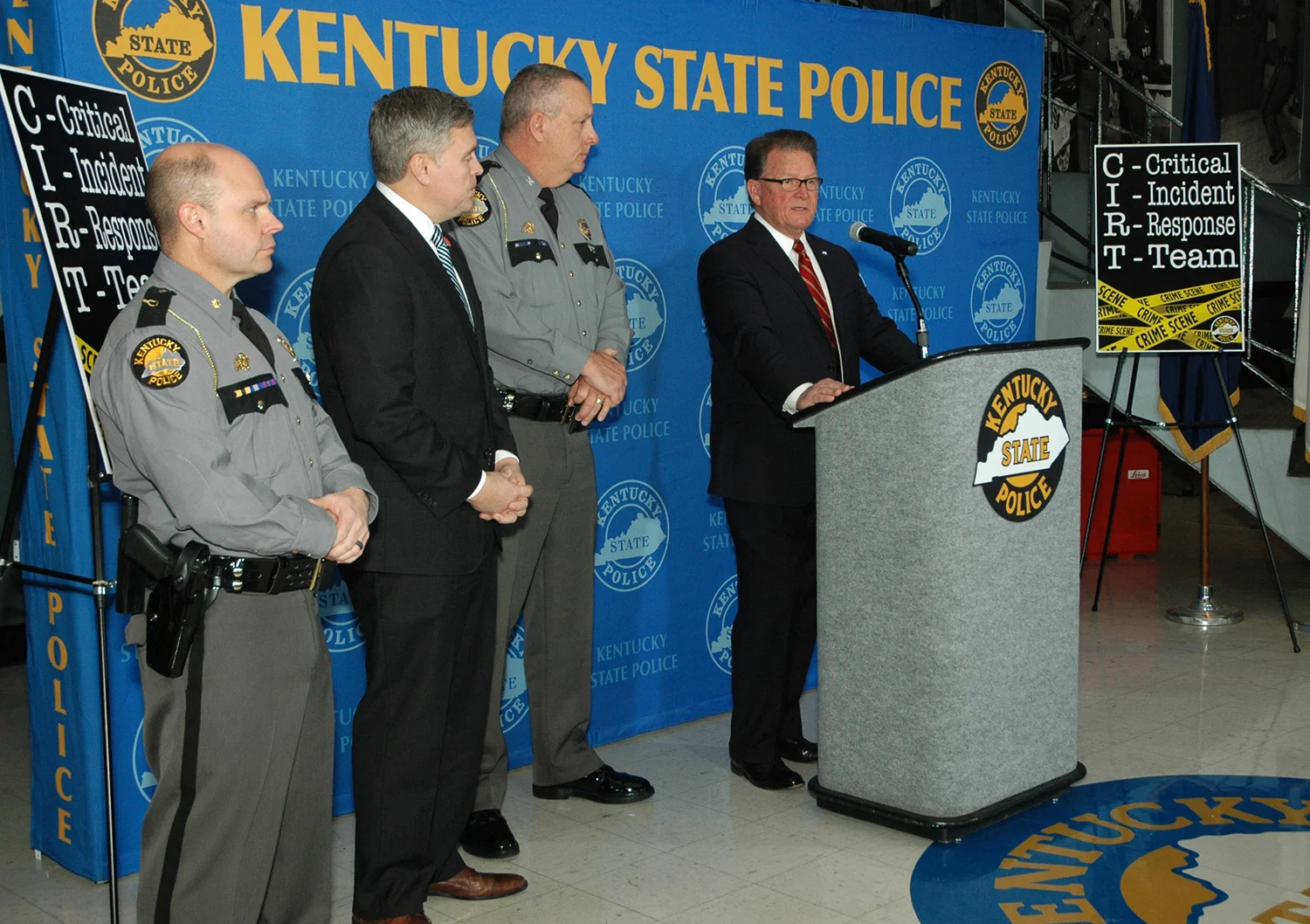 KSP Commissioner Rick Sanders at the news conference flanked by Deputy Commissioner Alex Payne, Justice and Public Safety Cabinet Secretary John Tilley and Maj. Jeremy Slinker. -Photo by Les Williams