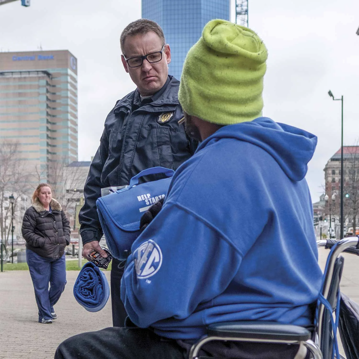 Lexington Police Officer Howard Florence (below), speaks to a homeless individual in downtown Lexington. Working most of his time in downtown, Florence regularly encounters homeless residents in need of assistance. (Photo by Jim Robertson)