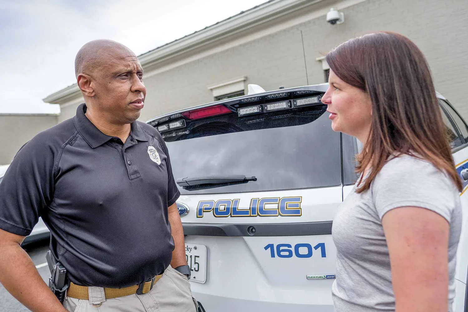 Danville Police Chief Tony Gray speaks with Detective Lisa Dollins outside the police department. Gray said his agency tries to nudge officers in the career path that best suits their individual skill sets. (Photo by Jim Robertson)