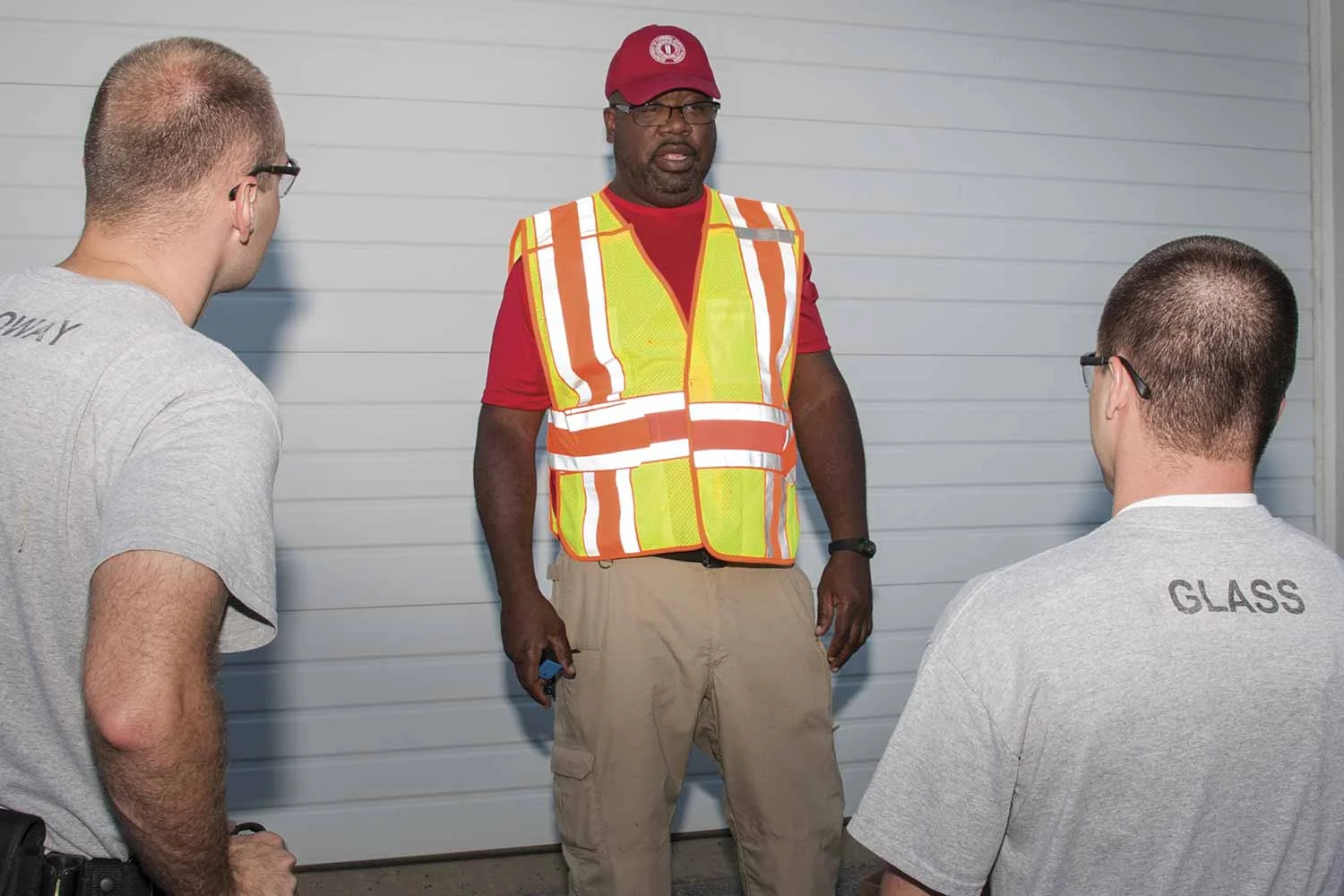 Department of Criminal Justice Training Instructor Shawn Maxie, center, speaks with DOCJT Basic Training Class 486 members Caleb Holloway, left, from the Owensboro Police Department, and Zane Glass with the Franklin Police Department during the Patrol: Counter-Ambush Practical Exercises course taught in October. (Photo by Jim Robertson)